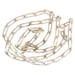 An 18k yellow gold long chain by Cartier.