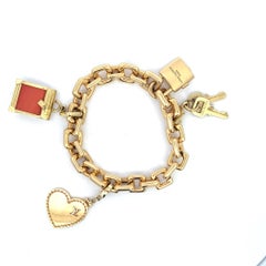 An 18k yellow gold "Padlock" bracelet with original box by Louis Vuitton.