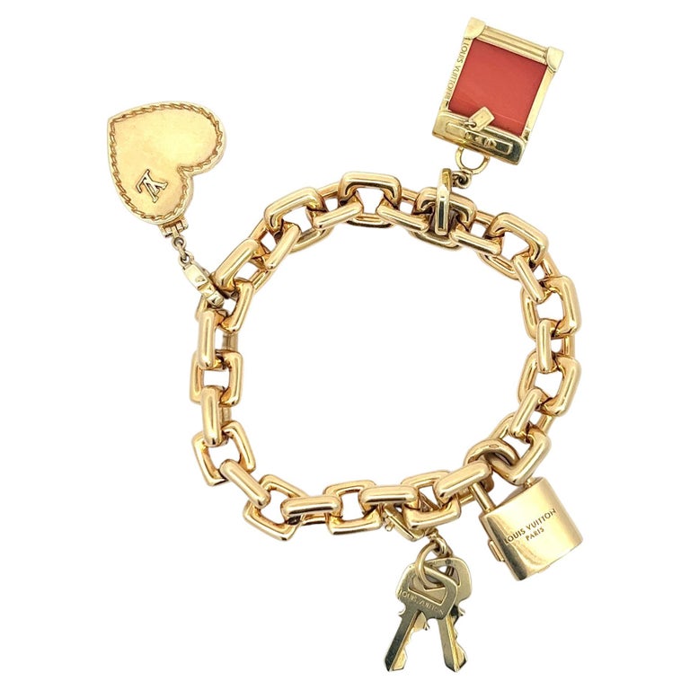 An 18k yellow gold Padlock bracelet with original box by Louis