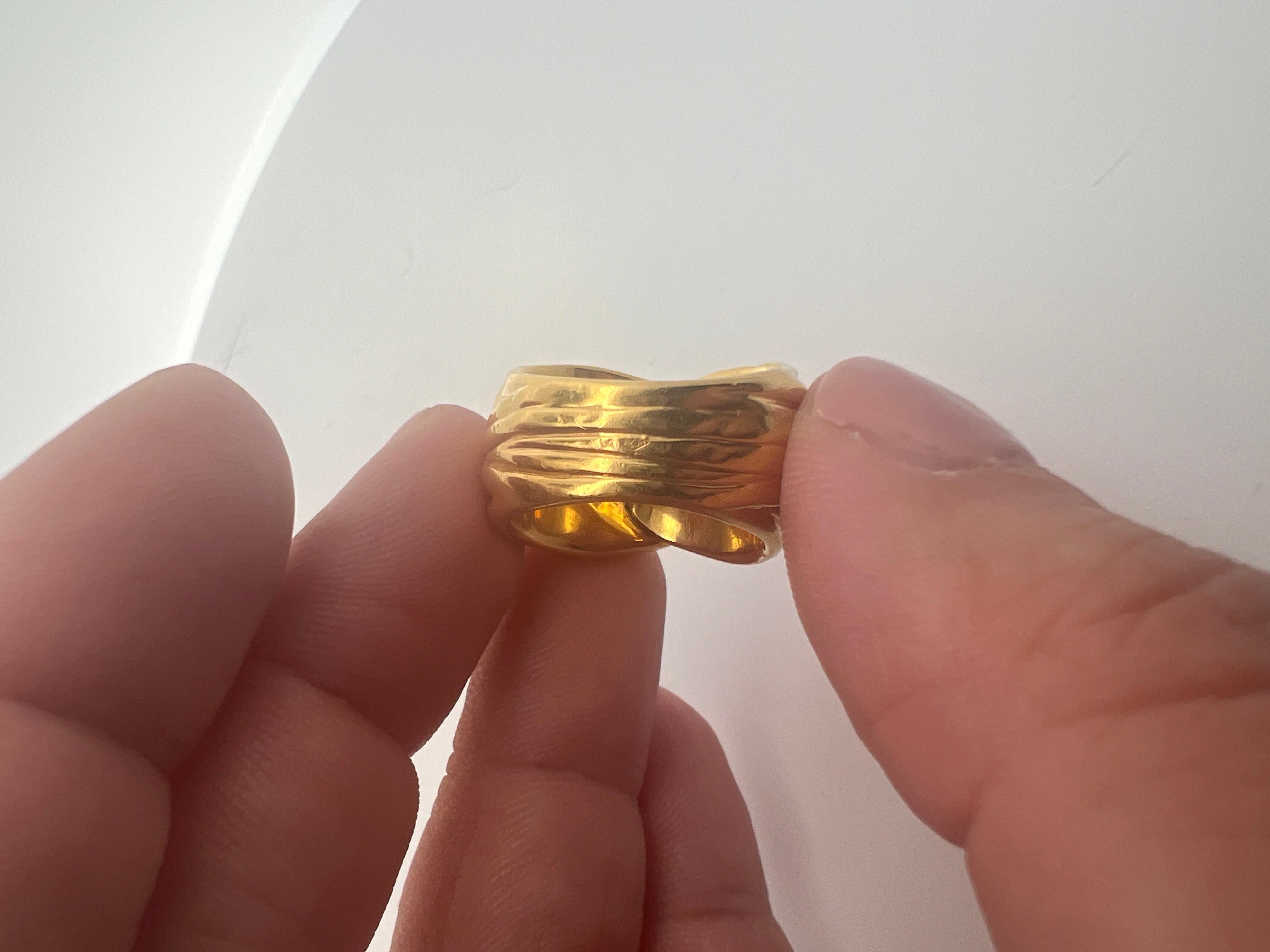 An 18k yellow gold ring by Yves Saint Laurent. 6