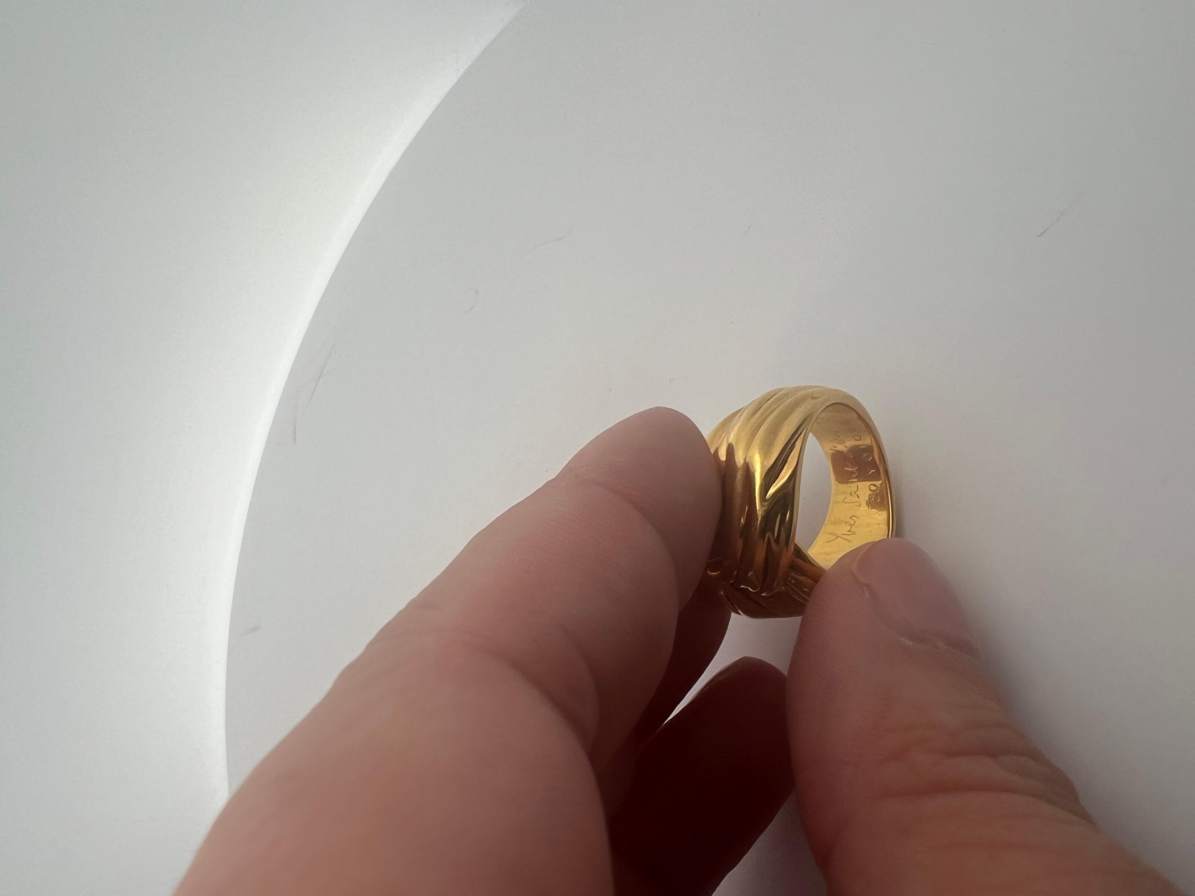 An 18k yellow gold ring by Yves Saint Laurent. 8