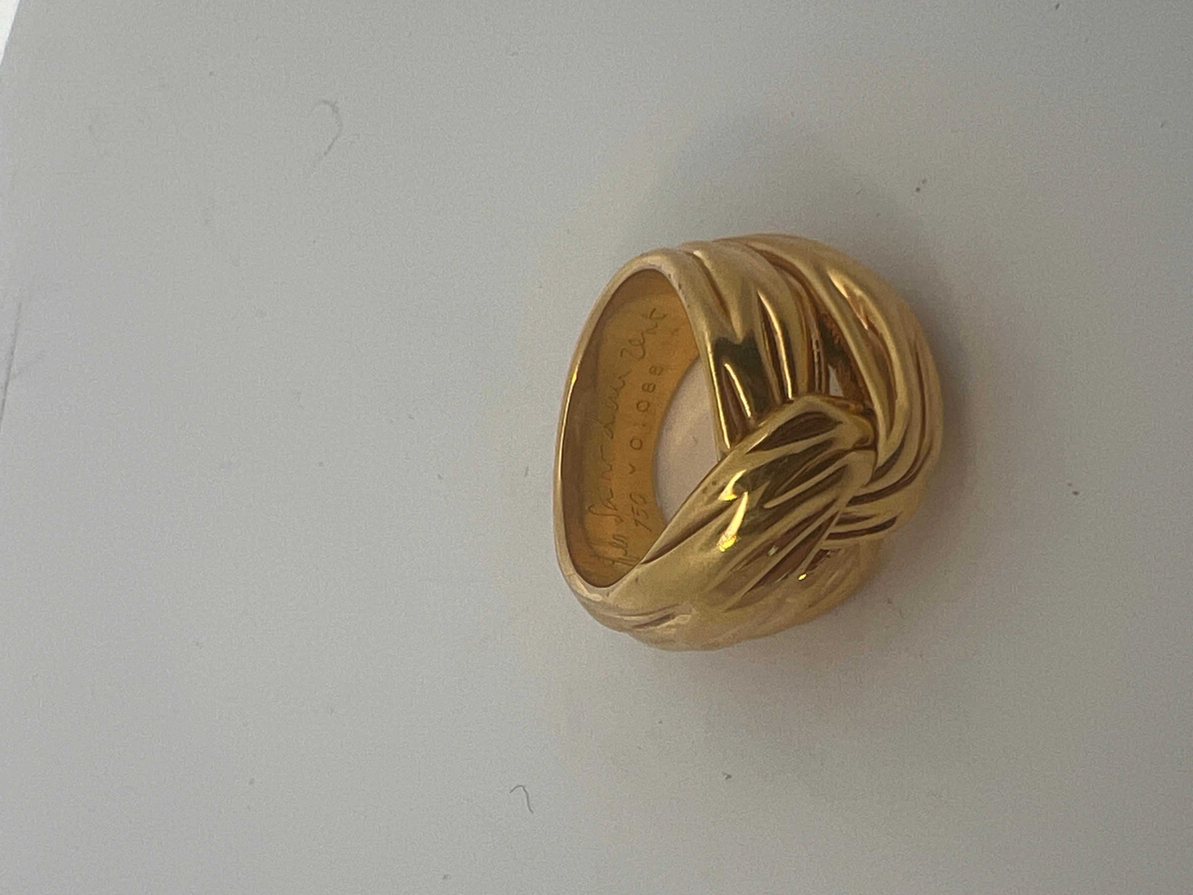 An 18k yellow gold ring by Yves Saint Laurent. 9