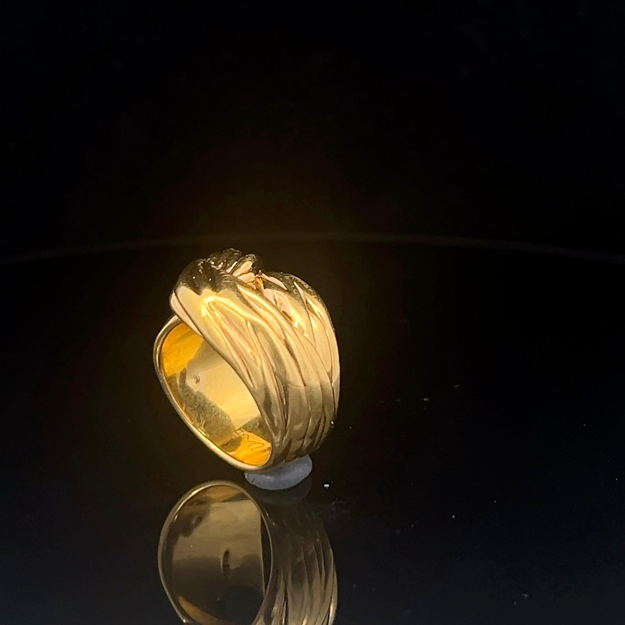 An 18k yellow gold ring by Yves Saint Laurent. 11