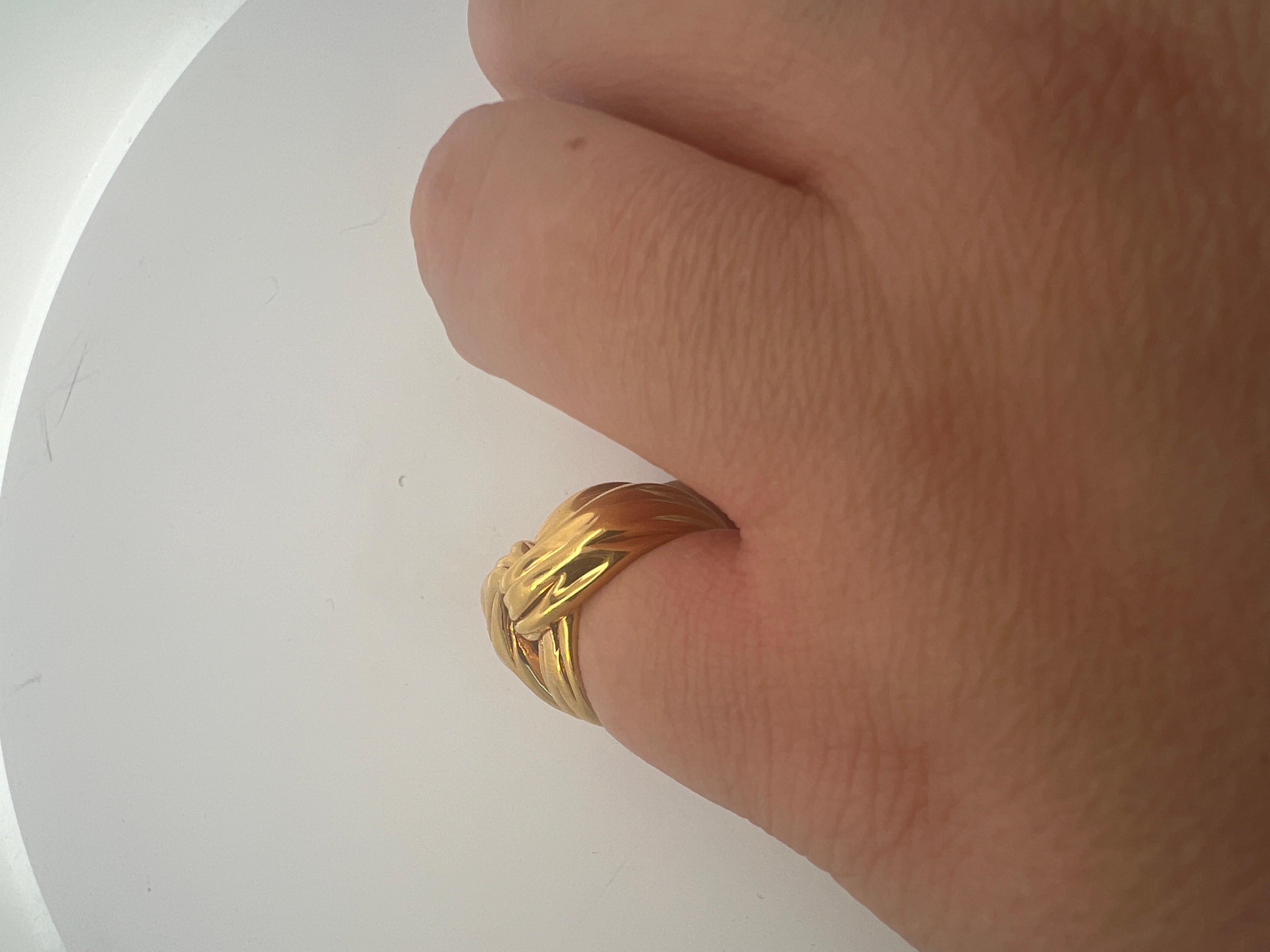 An 18k yellow gold ring by Yves Saint Laurent. 4