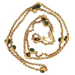 An 18k yellow gold, tiger's eye quartz and nephrite long chain by Pomellato.