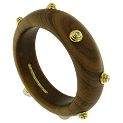 Retro An 18k yellow gold, Wood and Diamond bangle by Christian Dior.