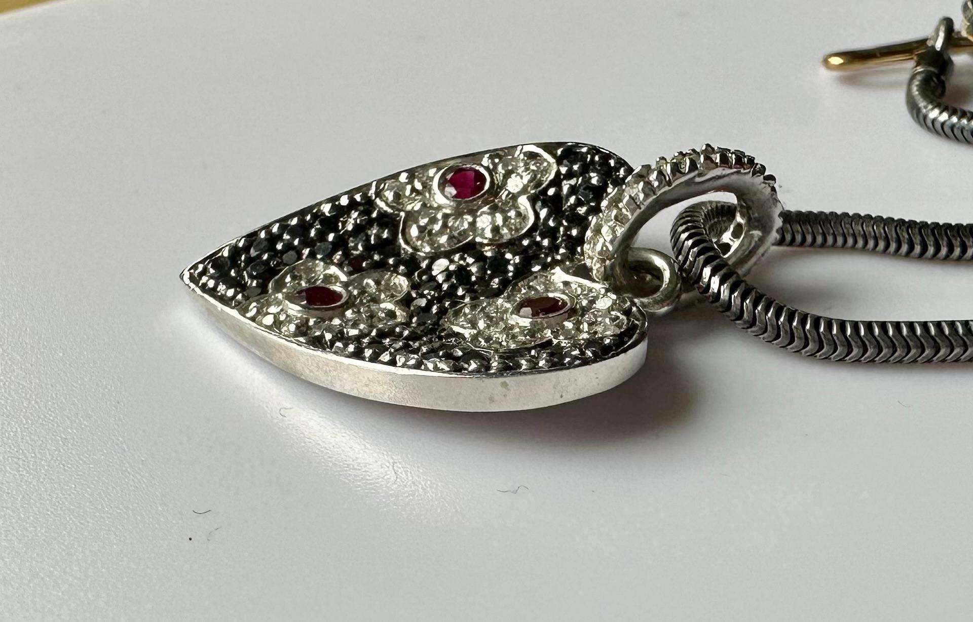 An 18kt White Gold Heart Shaped Pendant set with Rubies & Diamonds. For Sale 2