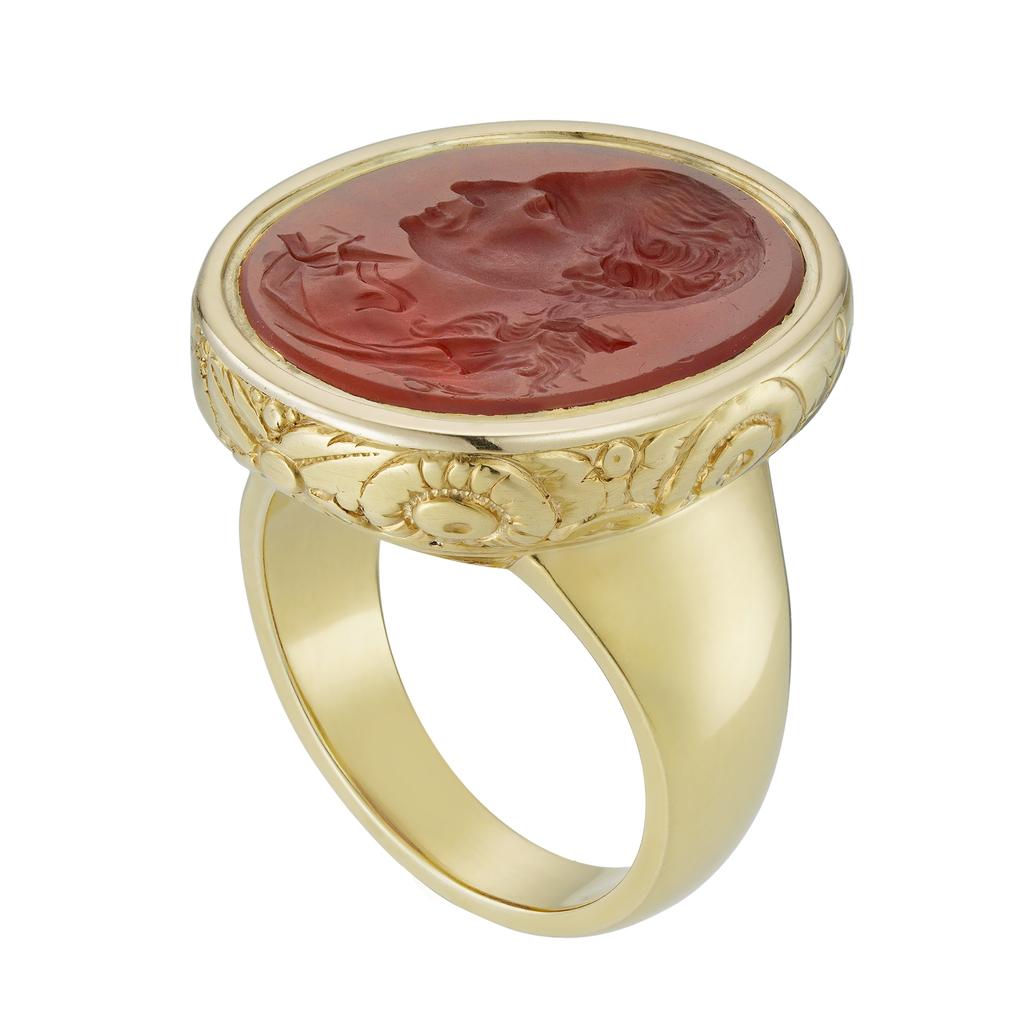A late 18th century carnelian intaglio mounted as a ring, the intaglio carved after the 1772 medal of Garrick by Lewis Pingo, 1743-1830,  a cast of which is in the British Museum, London (inv. no. 1906,1103.386); the head size measuring 22.3 by 24.9