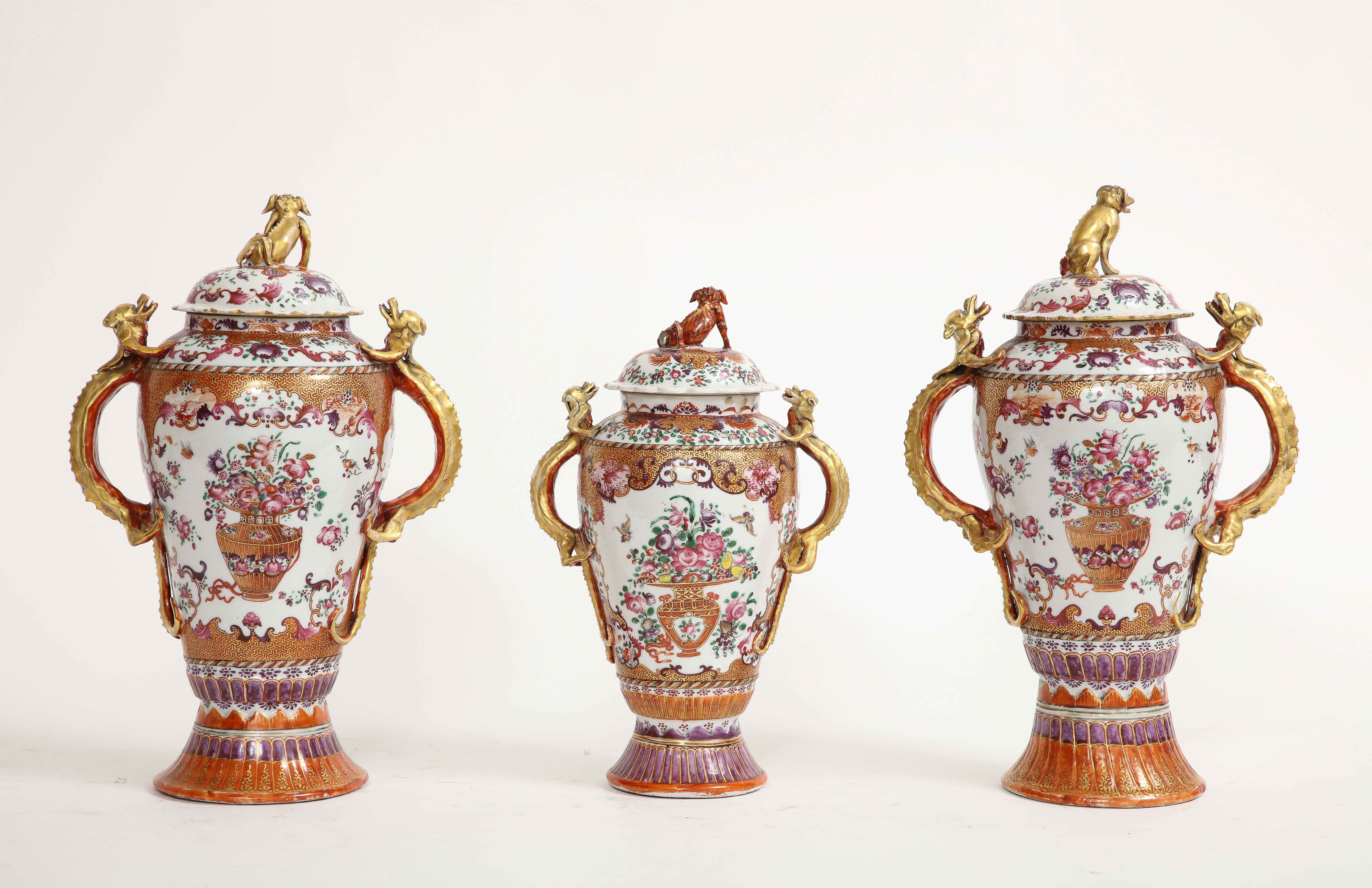 An 18th century Chinese Porcelain Famille Rose Mandarin 3-Piece vase Garniture Set. A status symbol between the 17th and 19th centuries, most garniture sets have by now been damaged or broken up with the individual pieces sold off. Few complete sets