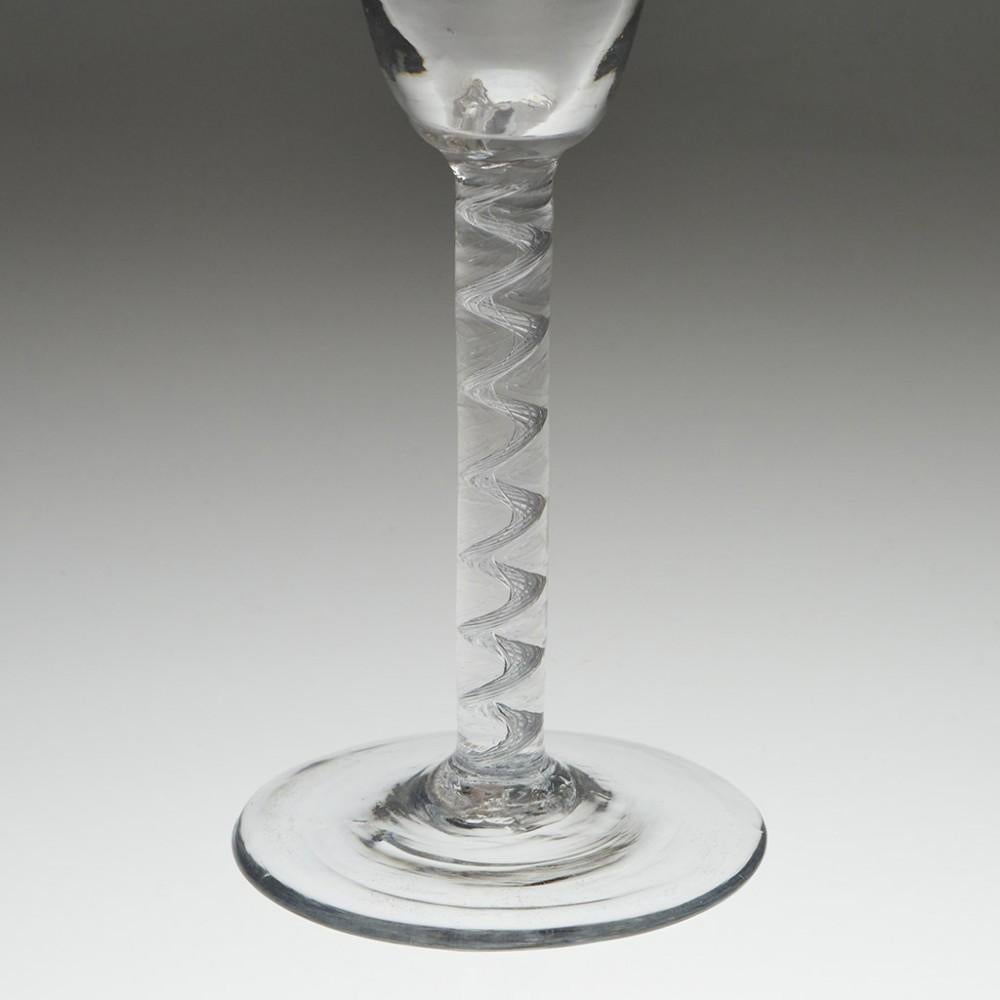 An 18th century Air Twist Wine Glass, circa 1750

Additional information:
Period : George II
Origin : England 
Colour : Clear 
Bowl : Round funnel
Stem : A multi-thread air twist cable
Foot : Conical
Pontil : Snapped
Glass Type : Lead