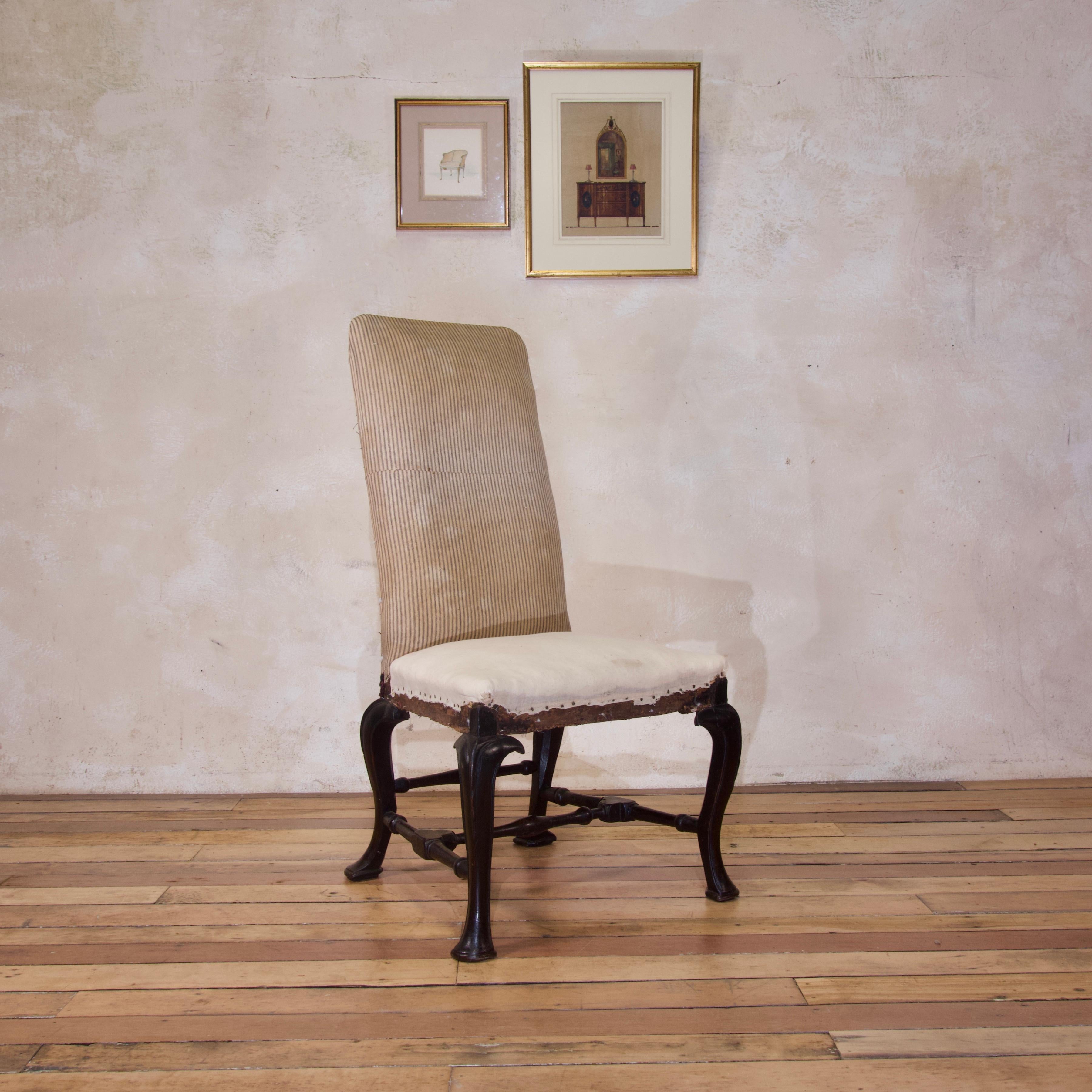 Elegant and superbly crafted, this side chair is a particularly refined expression of Queen Anne Furniture. Dating from the early 18th century, circa 1710.
Raised on an ebonised walnut base, demonstrating upholstered tapering rectangular back and