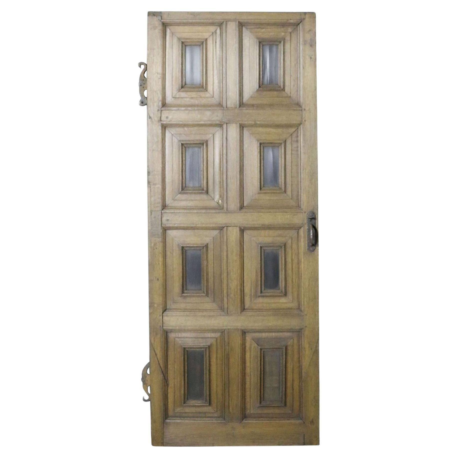 An 18th Century English Eight Panel Oak Door For Sale