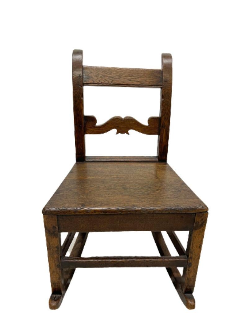 An 18th century English oak children's rocking chair

An lovely 18th century English oak rocking chair for children
Made of solid oak with a beautiful original patina

The measurements are 75 cm high, 46 cm wide and 46 cm depth
The seat height