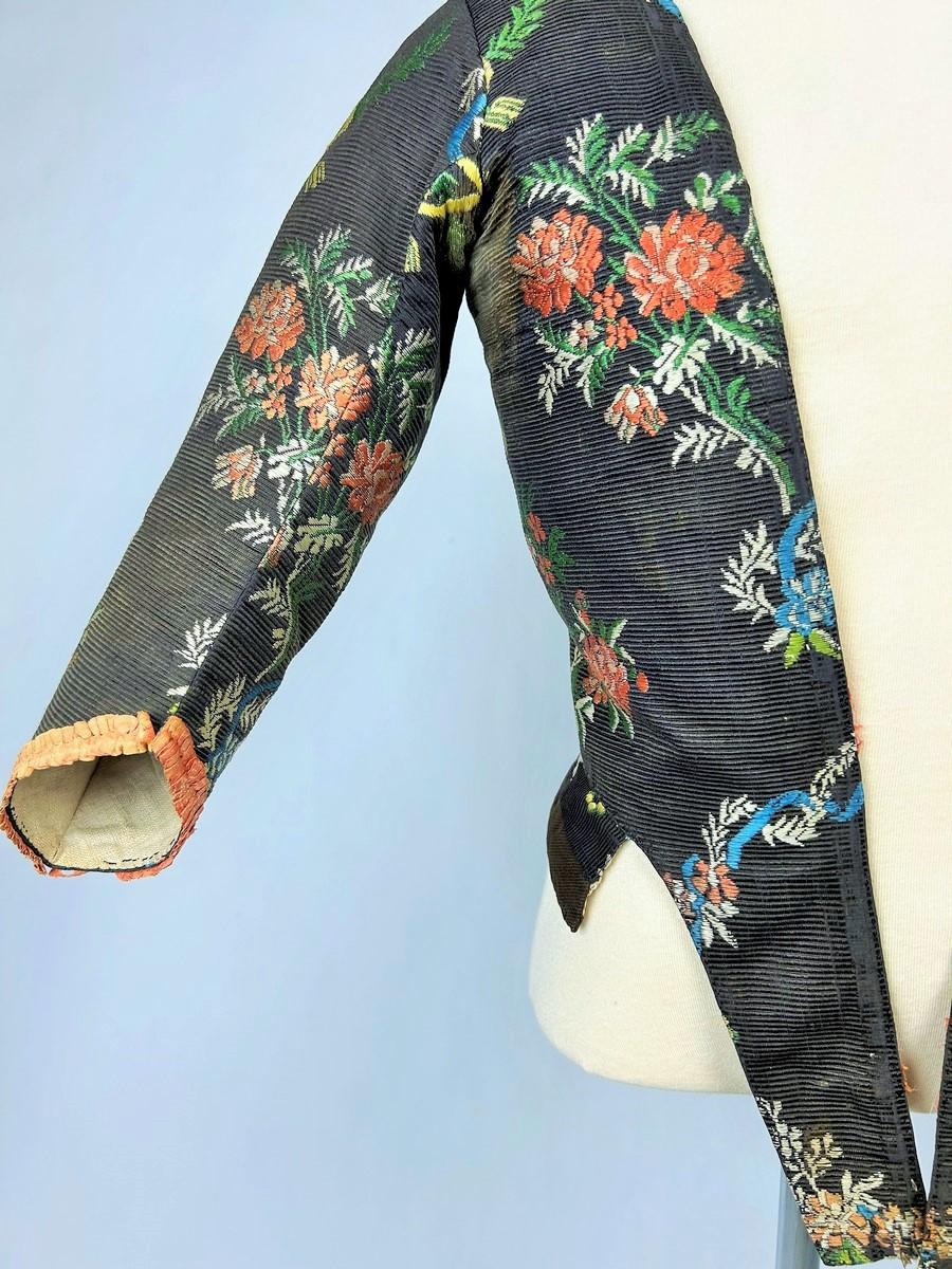 Black An 18th century French brocaded silk bodice Caraco - France Circa 1750
