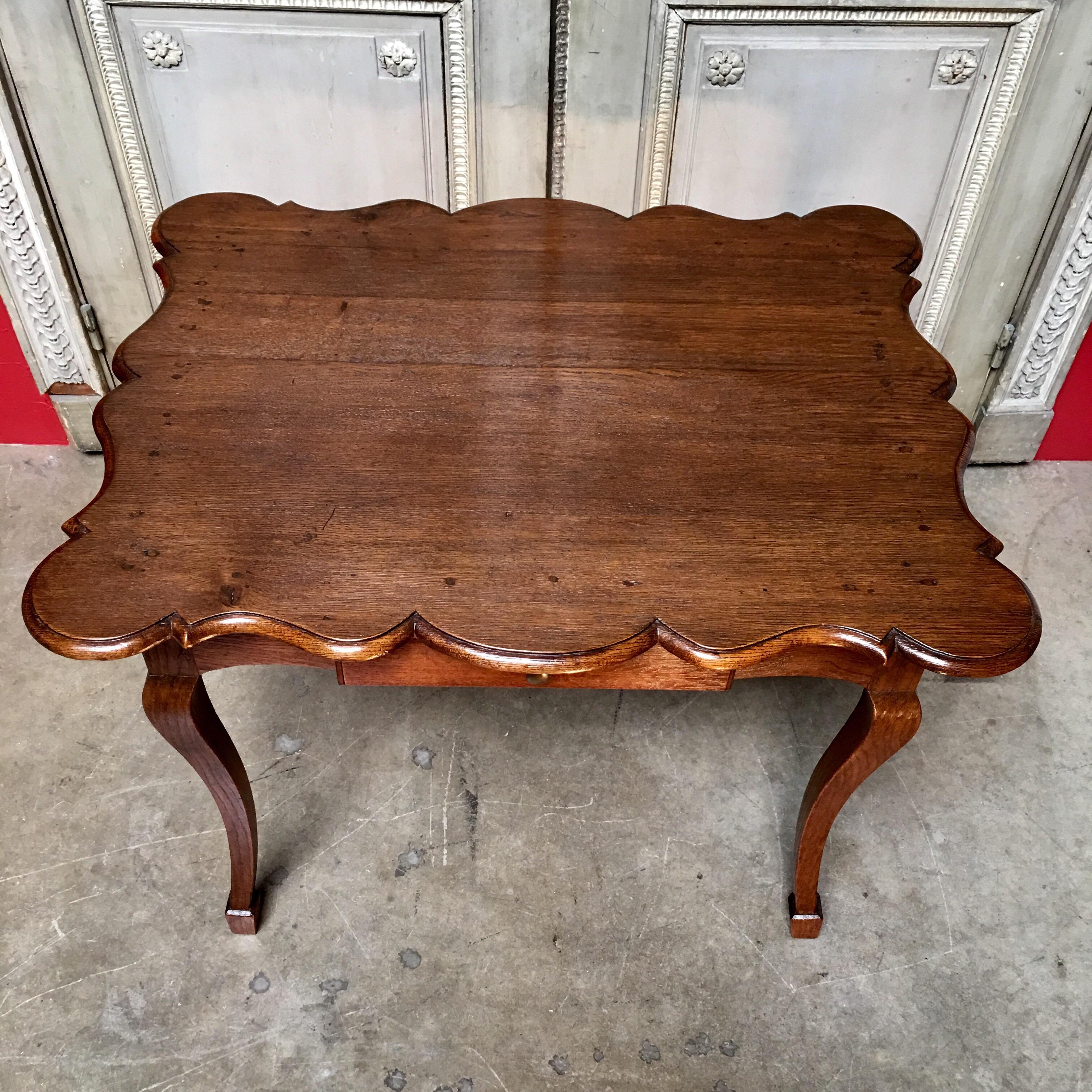 Carved 18th Century  Louis XV French Oak Writing Table with Scalloped Shaped Top For Sale