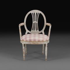 An 18th Century Gustavian Painted Elbow Chair with Gingham Seat