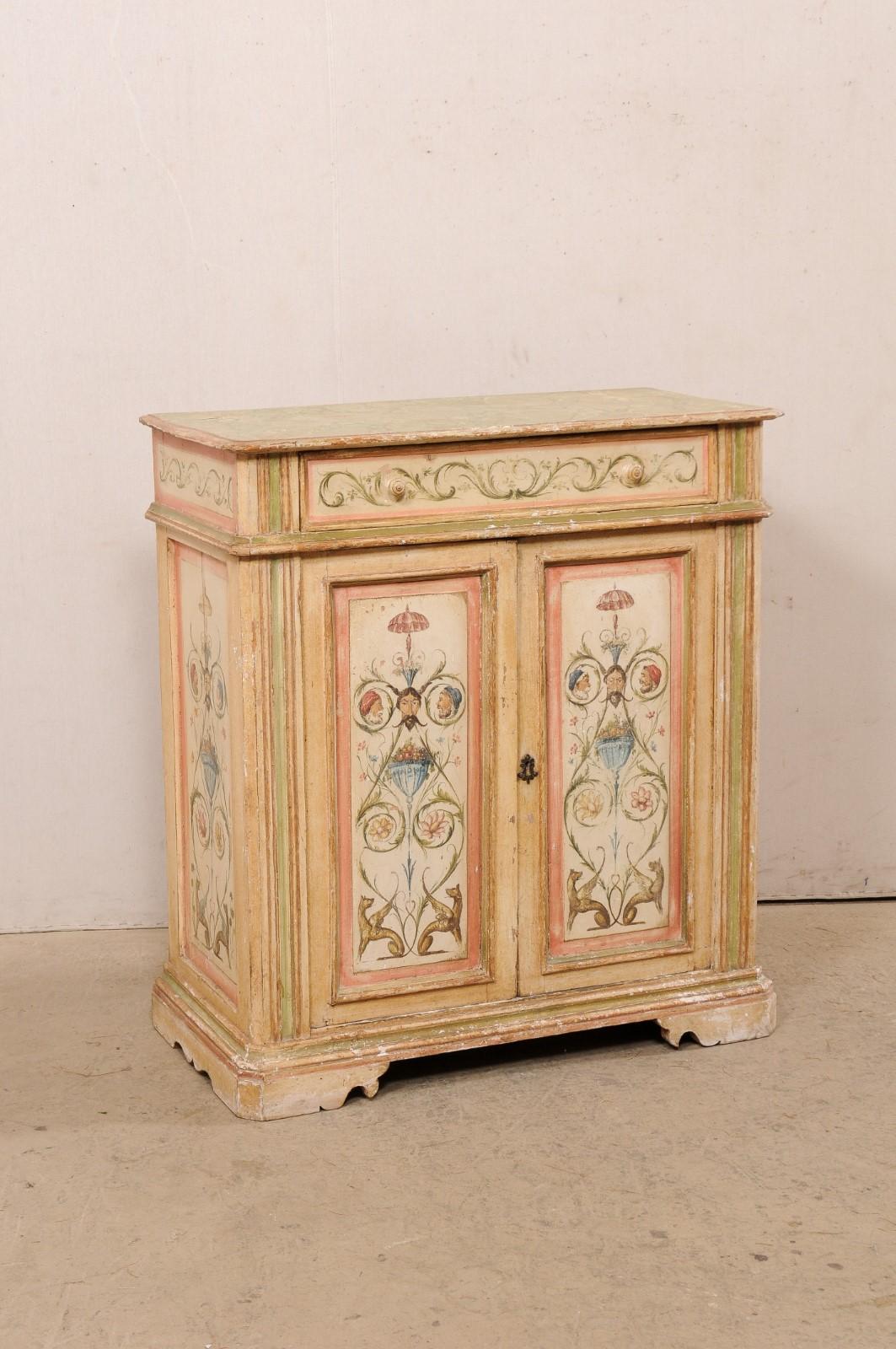 An Italian hand-painted cabinet from the 18th century. This antique cabinets from Italy has a rectangular-shaped top which slightly overhangs the case below which is fitted with a single top drawer over pair of doors. The exquisite hand-painted