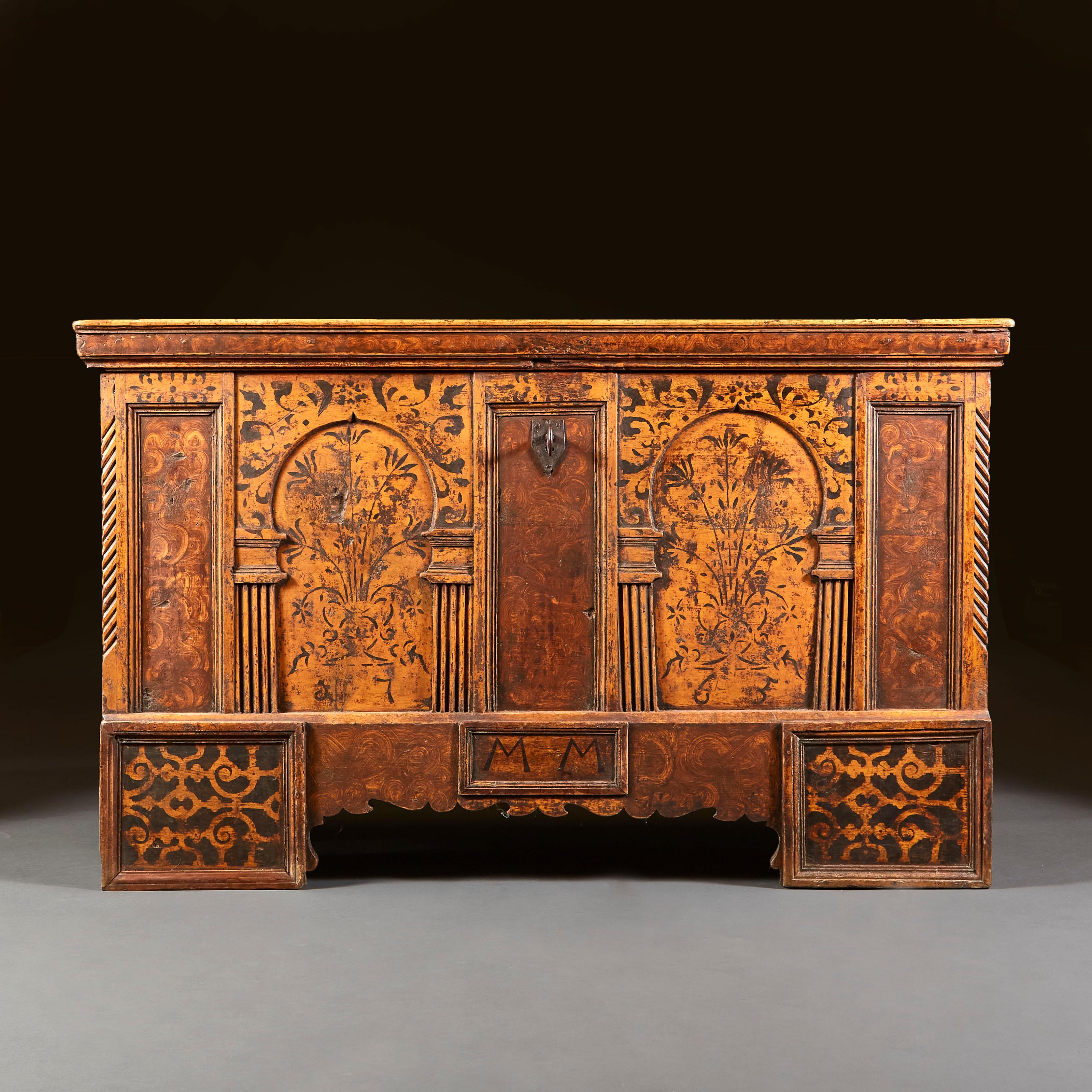 A rare mid eighteenth century Italian marriage coffer, decorated with two architectural arches to the front, filled with sprays of flowers and surrounded by painted scrolling motives, the feet and sides also with painted scrolling decoration. The
