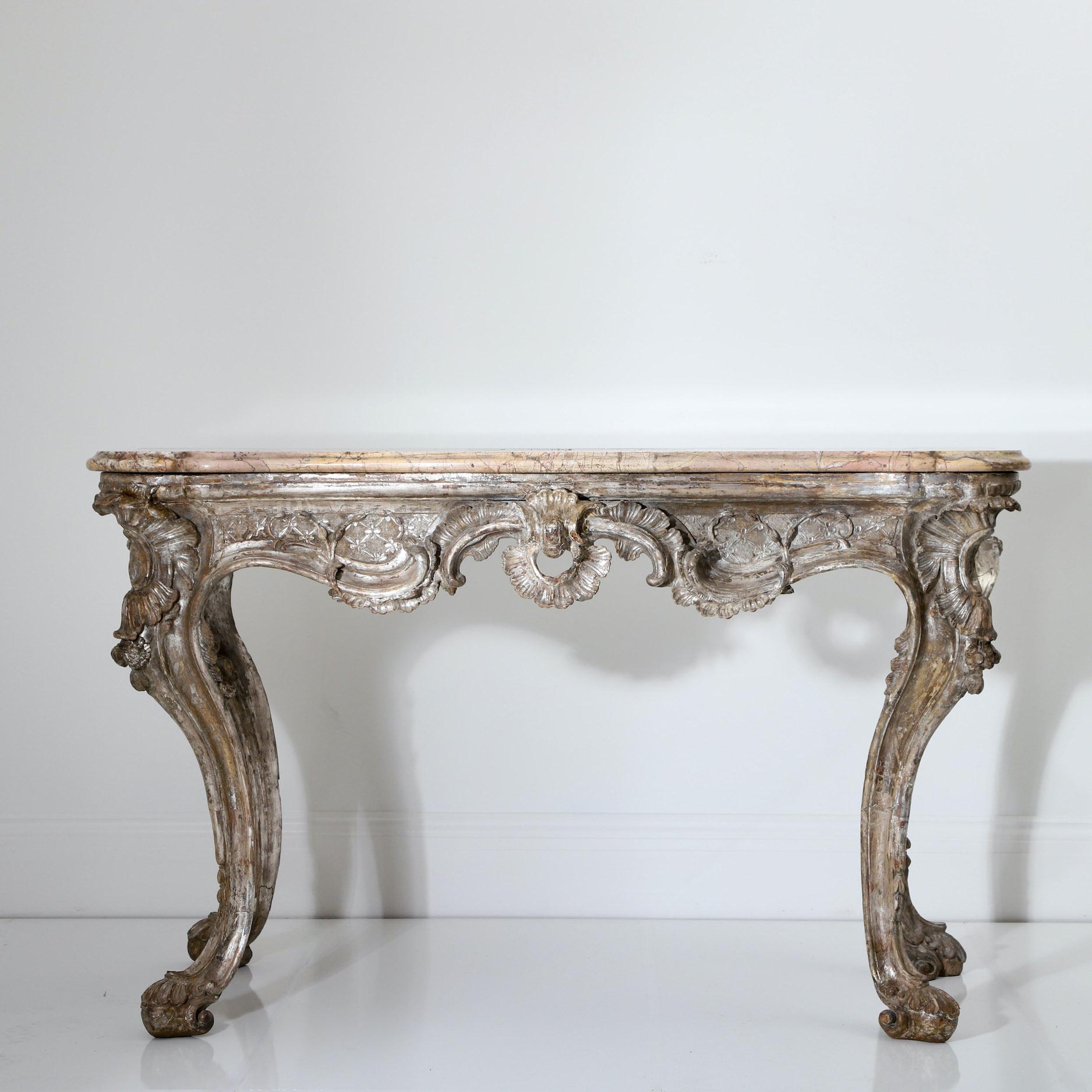Vagabond Antiques presents an 18th century Italian console table

Italy, Naples, Circa 1740

” A stunning 18th century console table that has a fantastic stance and presence, we have removed a much later gilded surface to reveal the original