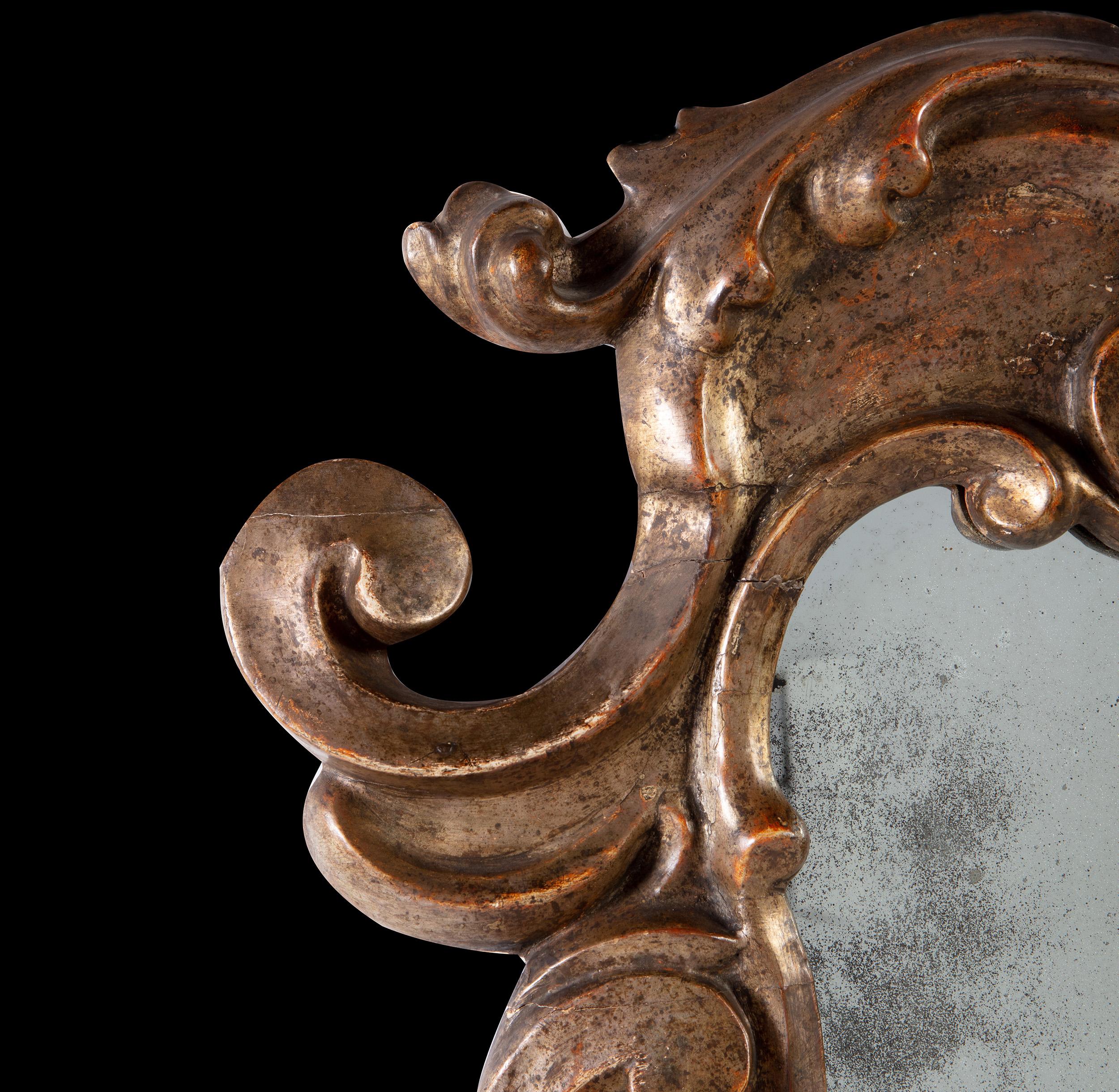 A fine 18th century carved and silver gilt Italian mirror, with mercury glass plate.