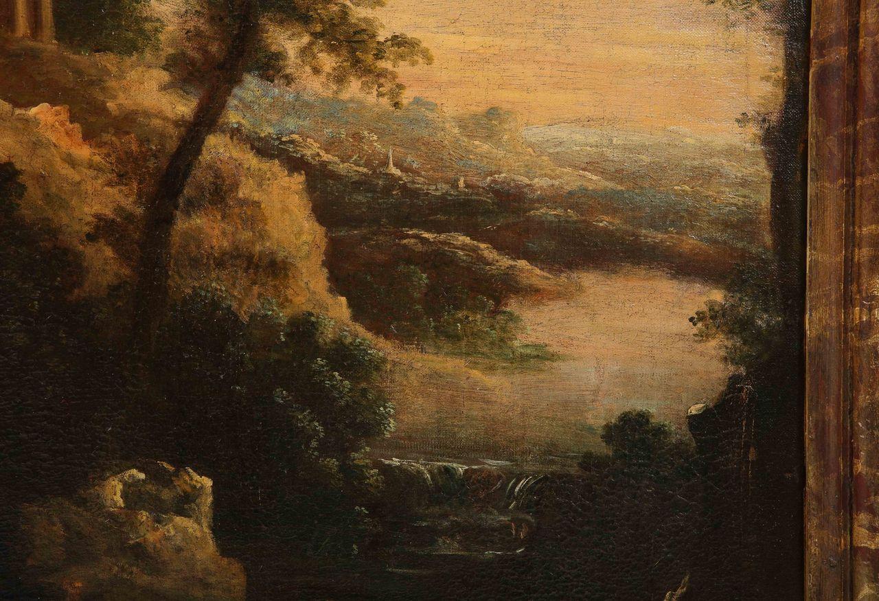 This beautiful oil on canvas painting takes the viewer to 18th-century France.  This moody yet serene scene illustrates the lush, verdant landscape of the French countryside. What appears to be a chateau is looming in the background, while the