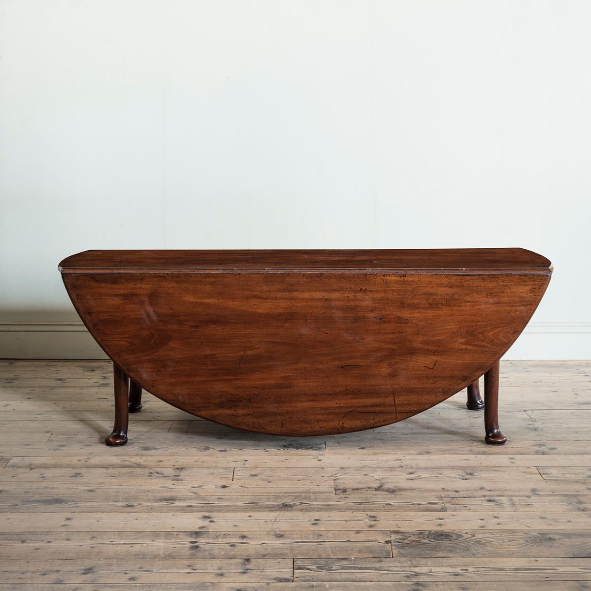 English An 18th Century Large Scale Drop Leaf Dining Table with Robust Pad Feet For Sale