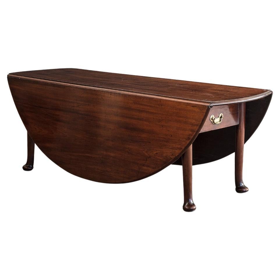An 18th Century Large Scale Drop Leaf Dining Table with Robust Pad Feet For Sale