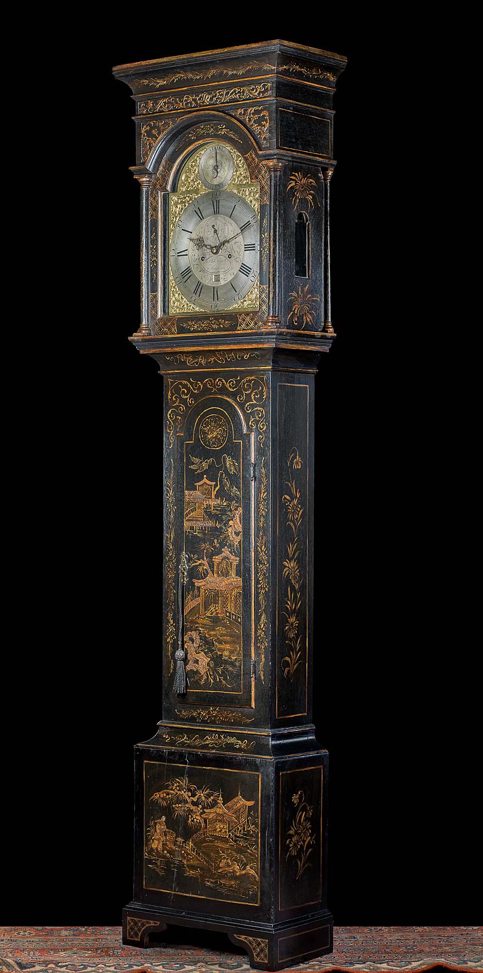 A fine oak longcase clock by Philip Avenell of Farnham with later lacquered chinoiserie decoration. The eight day movement strikes the hours on a clear bell. The clock face has a 12 inch brass break arched brass dial flanked by ornate gilt brass