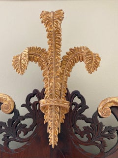 An 18th Century Mahogany and parcel gilt wall mirror.