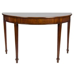 An 18th century mahogany demi-lune side, console or serving table.