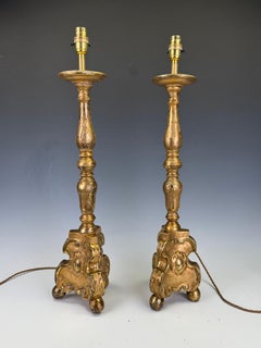 An 18th-Century Pair of Baroque Giltwood Candlestick Lamps