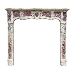An 18th Century Provincial Louis XV  Style Marble Fireplace Mantel