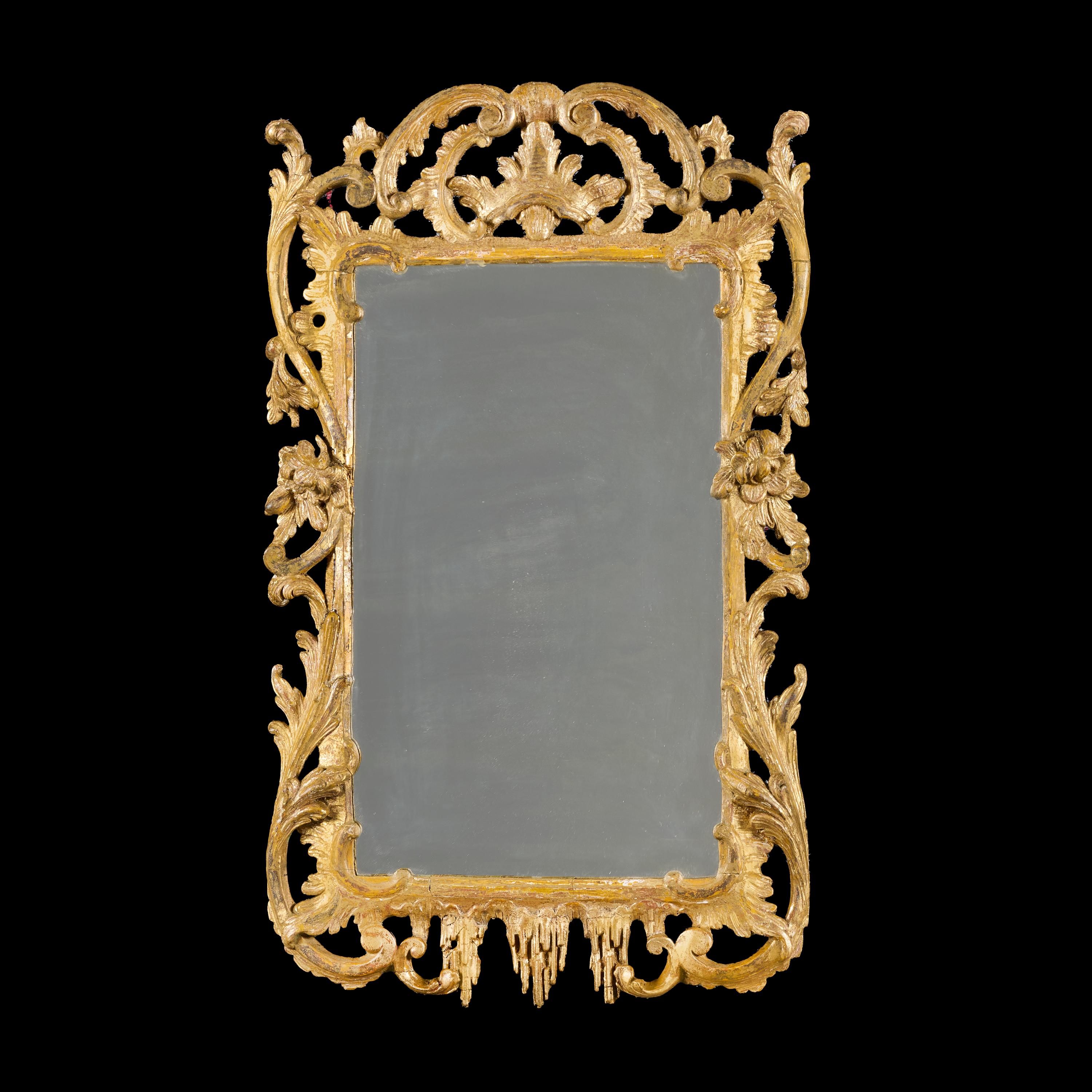 England, circa 1760.

A fine mid-eighteenth century giltwood Rococo mirror of well drawn foliate designs, decorated with stylised icicles to the lower frame, retaining the original gilding and mercury mirror plate.

Height 78.00 centimetres.

Width