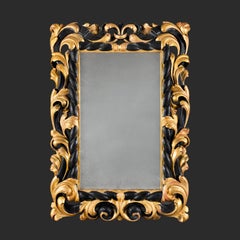 An 18th Century Tuscan Giltwood and Ebonised Mirror