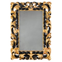 An 18th Century Tuscan Giltwood and Ebonised Mirror