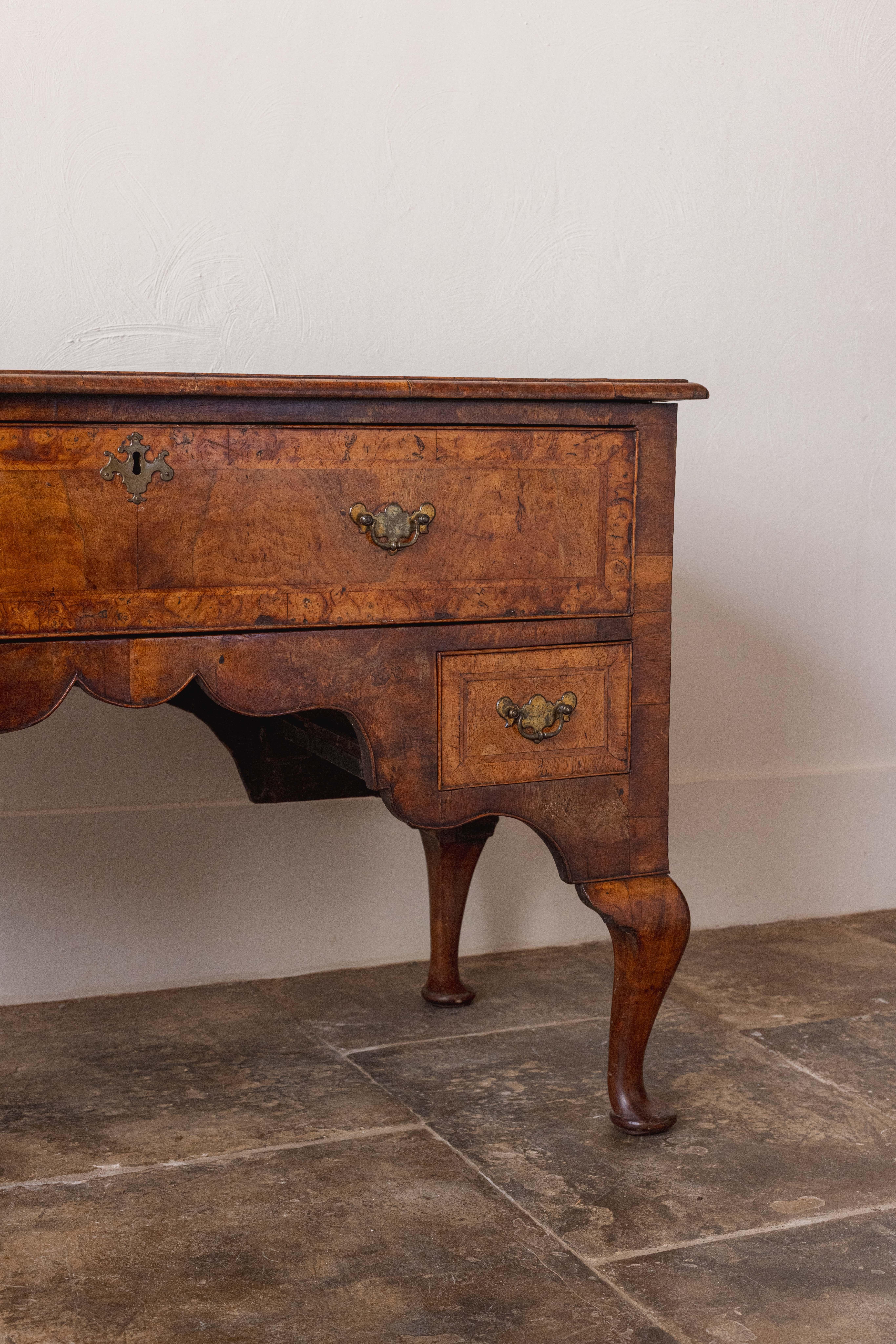 Queen Anne An 18th Century Walnut Lowboy For Sale