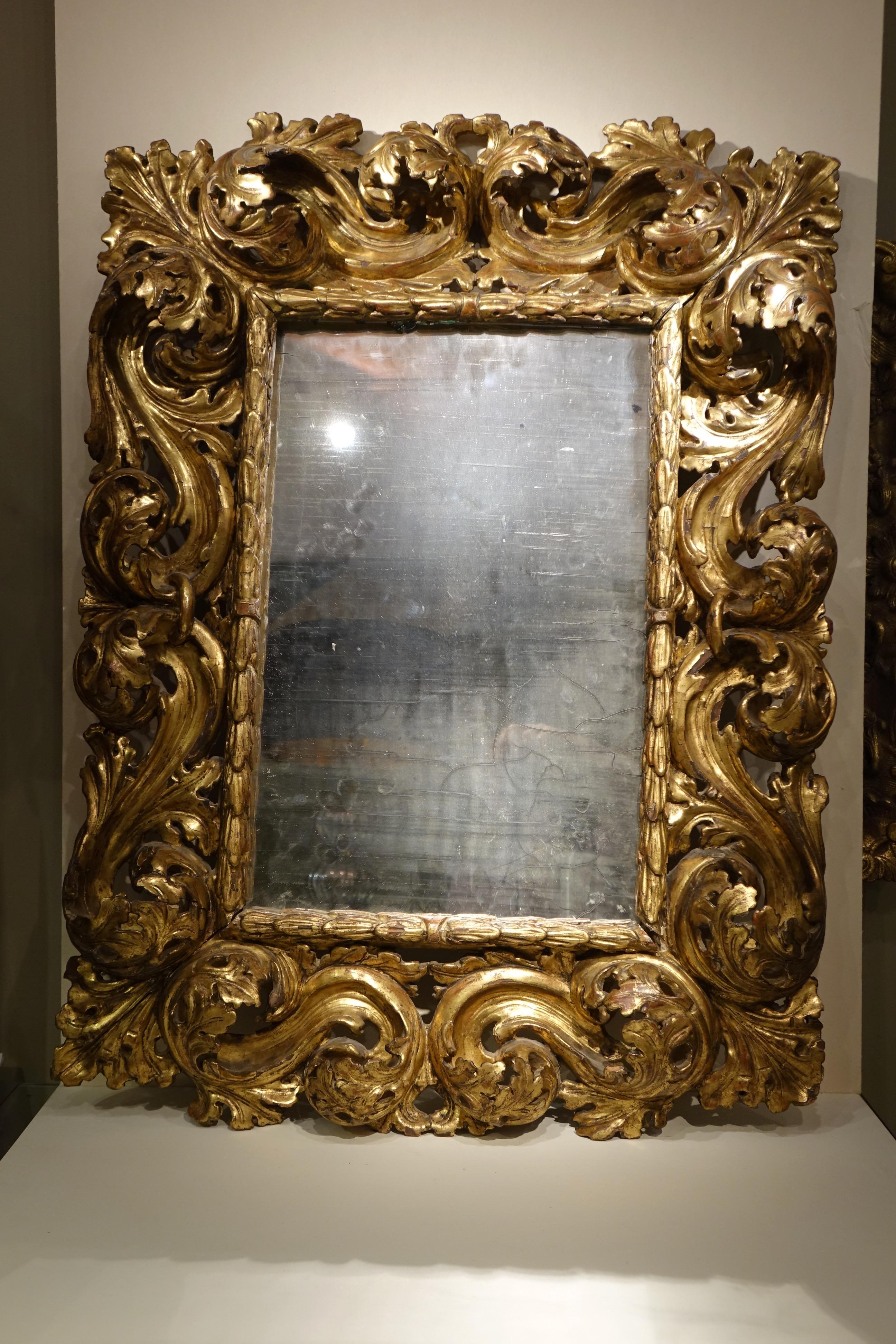 A beautiful carved and giltwood mirror called 