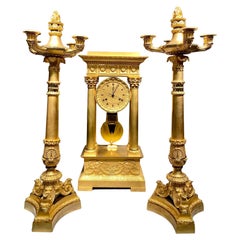 An 19th century ormolu Charles X clock garniture set.