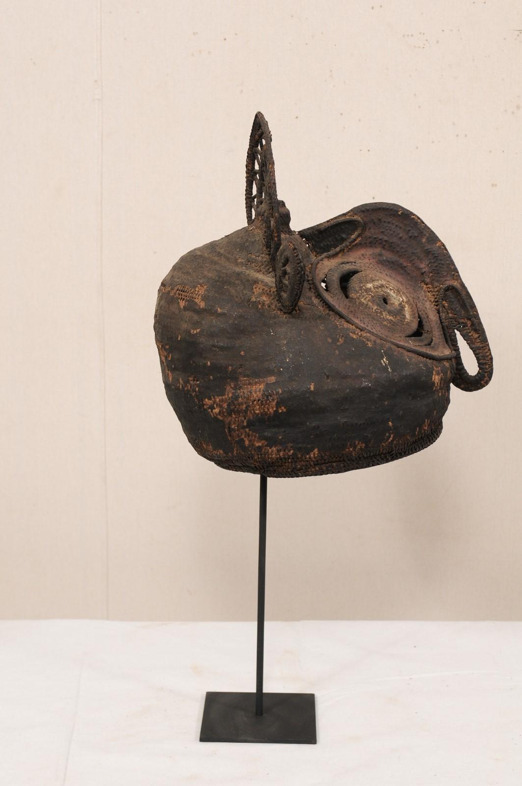 A Papua New Guinea yam festival mask of a horn-billed bird from the mid-20th century. This vintage ceremonial mask, also referred to as a baba mask, originates from the Abelam people, along the East Sepik River Region, of Papua New Guinea. Yam