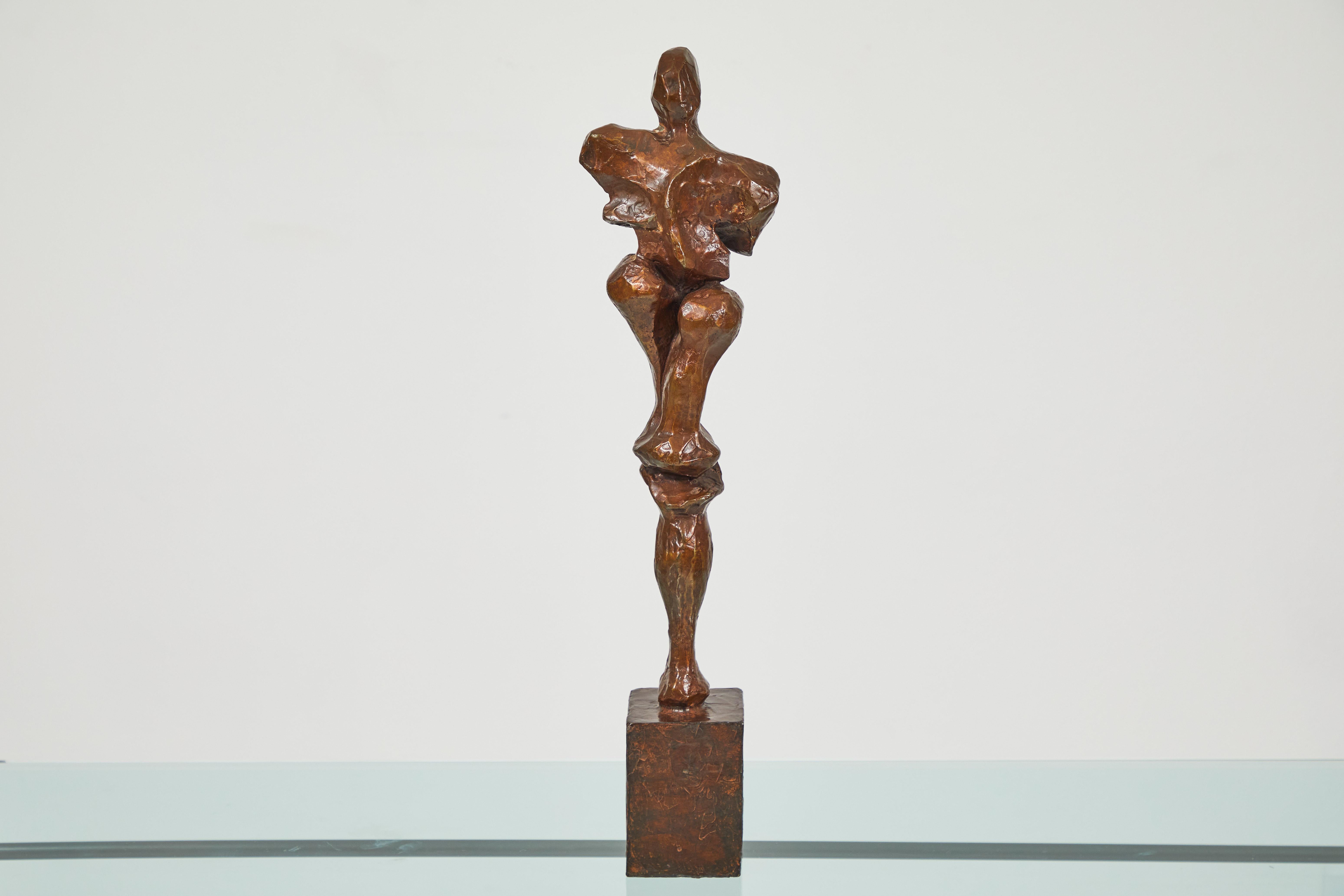 This is a wonderful abstract figure in bronze by well known sculpture, Sanford (Sandy) Decker. The patina is a beautiful shade of chocolate brown. It has aged well, bronze highlights can be seen. The base is bronze and a part of the sculpture . It