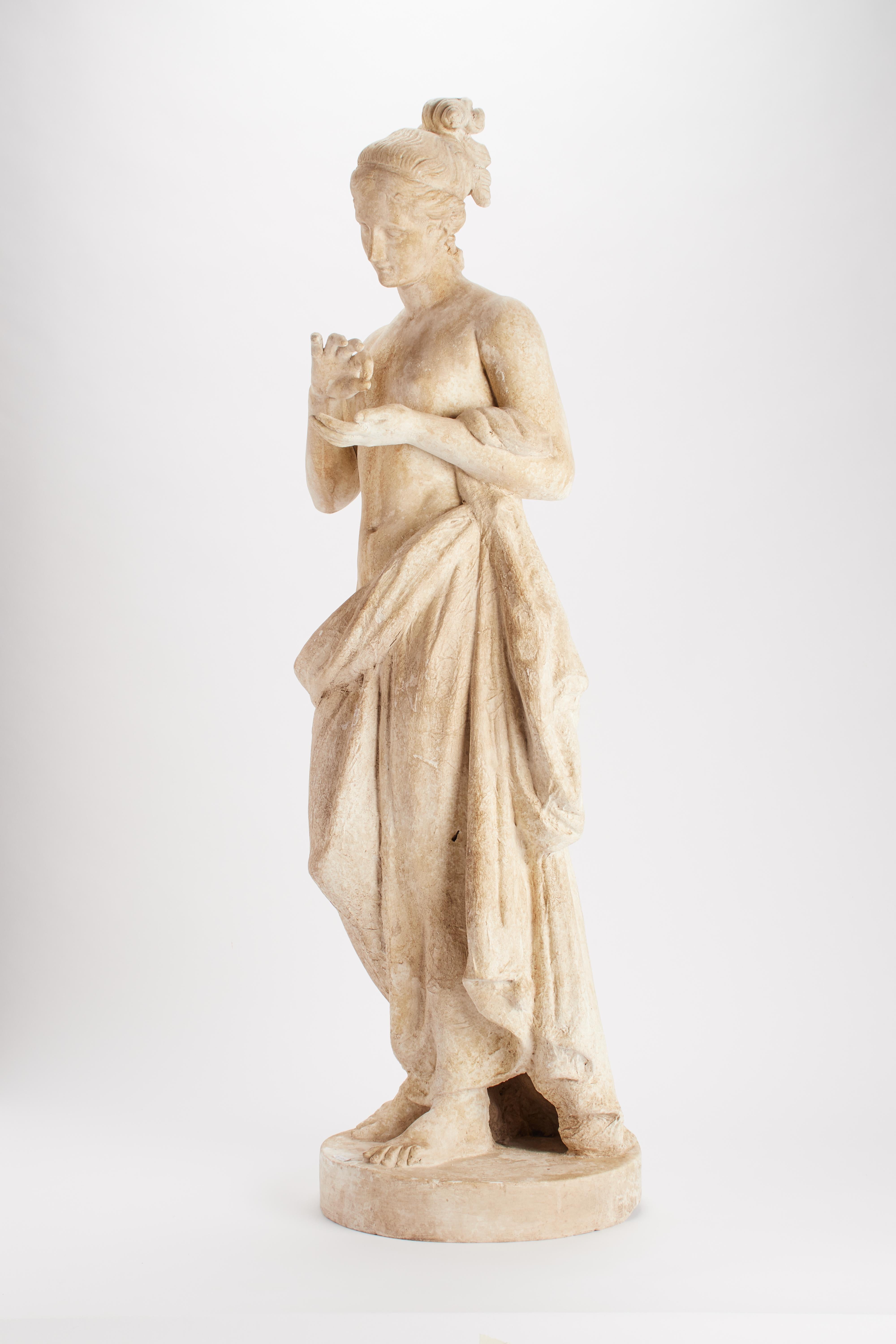 Over the plaster round base is set the cast of a sculpture of a Psyche. Plaster cast for drawing teaching in Academy. Made out of plaster and painted paper mâché, Italy, circa 1890.