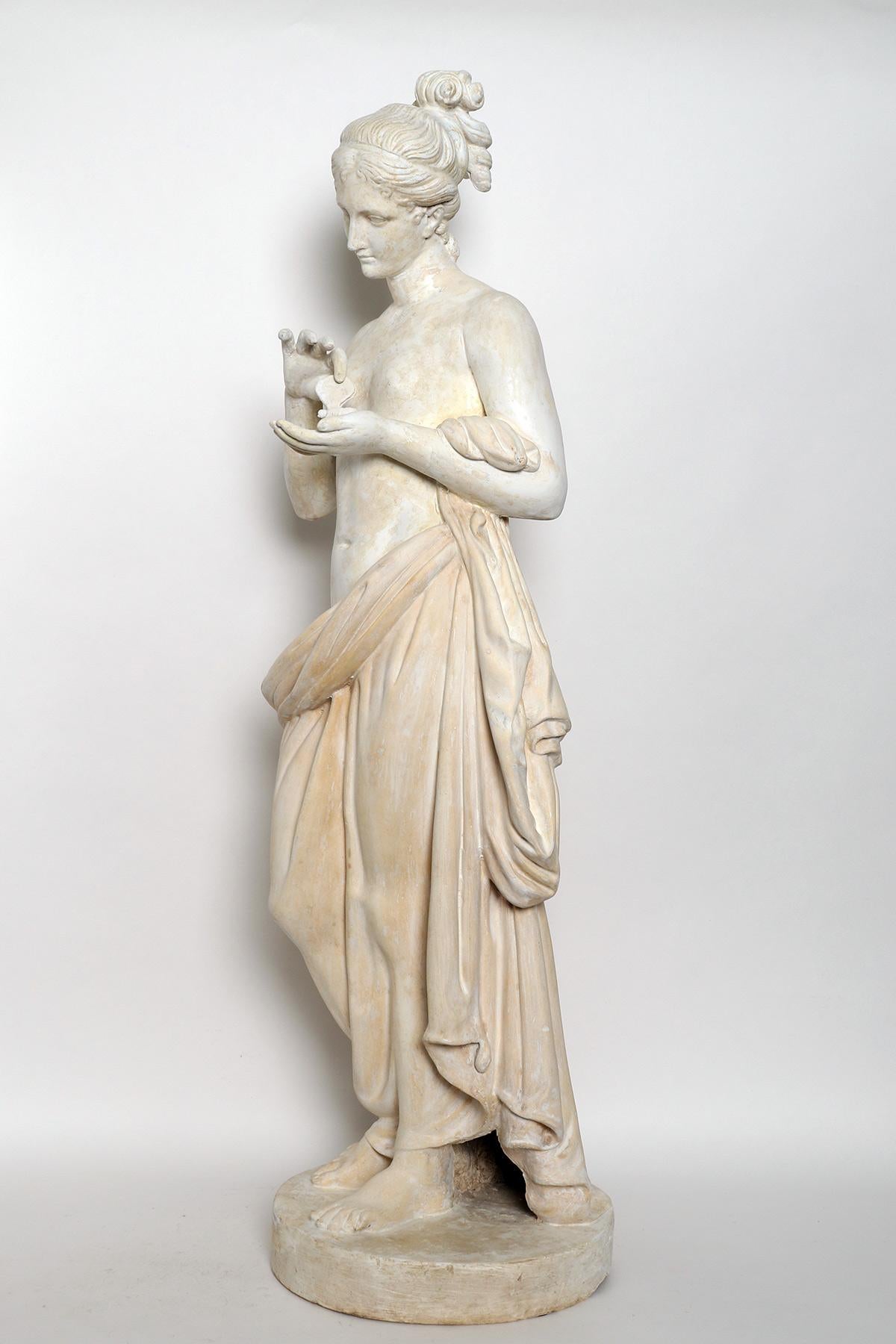 Over the plaster round base is set the cast of a sculpture of a Psyche. Plaster cast for drawing teaching in Academy. Made out of plaster and painted paper machè. Italy 1890 ca.