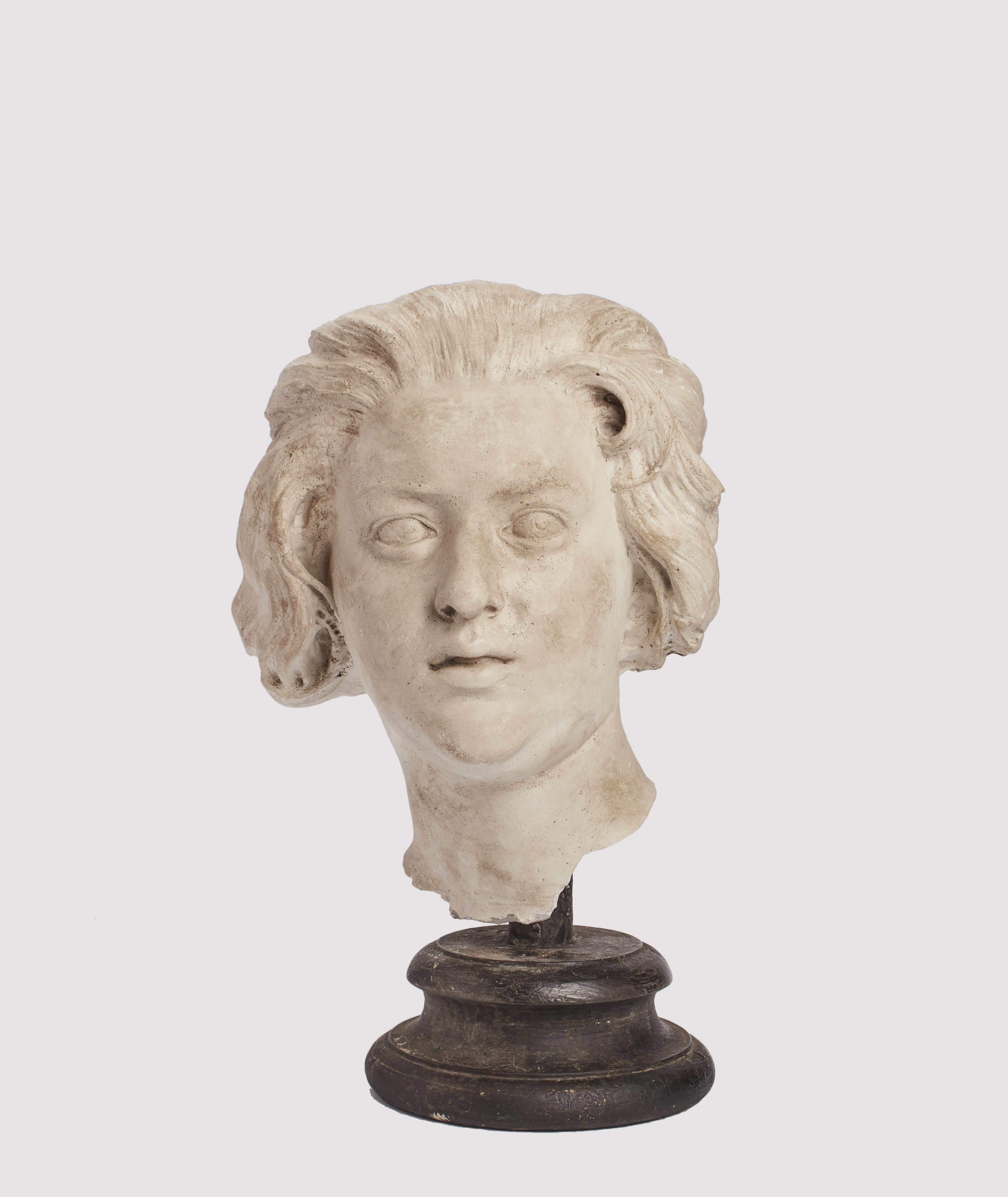 An academic cast. Over the fruit wooden black painted base is set the cast of Costanza Bonarelli head by Bernini. Cast for drawing teaching in Academy. Italy circa 1890. 