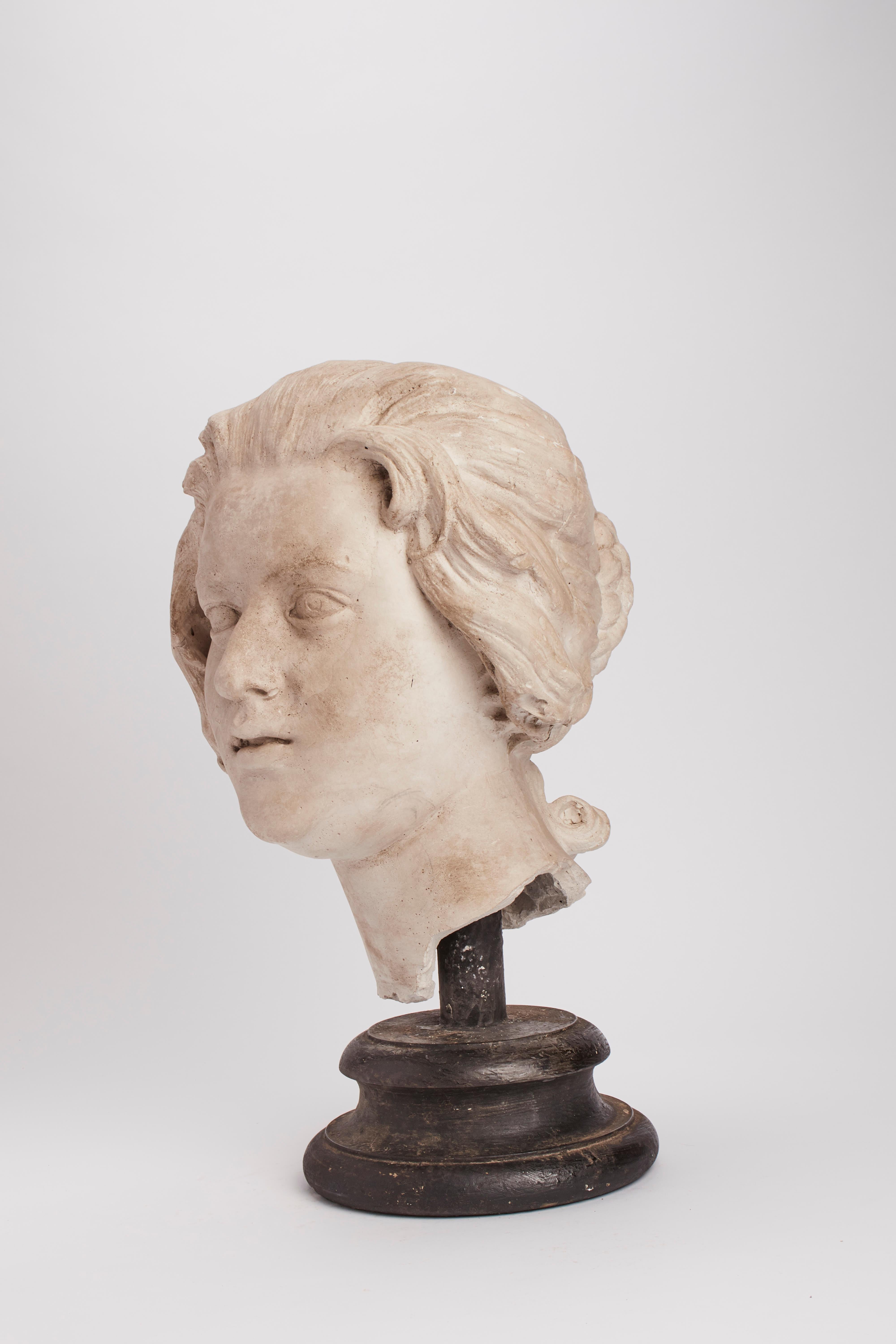 Over the wooden black painted base is set the cast of Costanza Bonarelli head by Bernini. The cast for drawing teaching in academy, Italy, circa 1890.