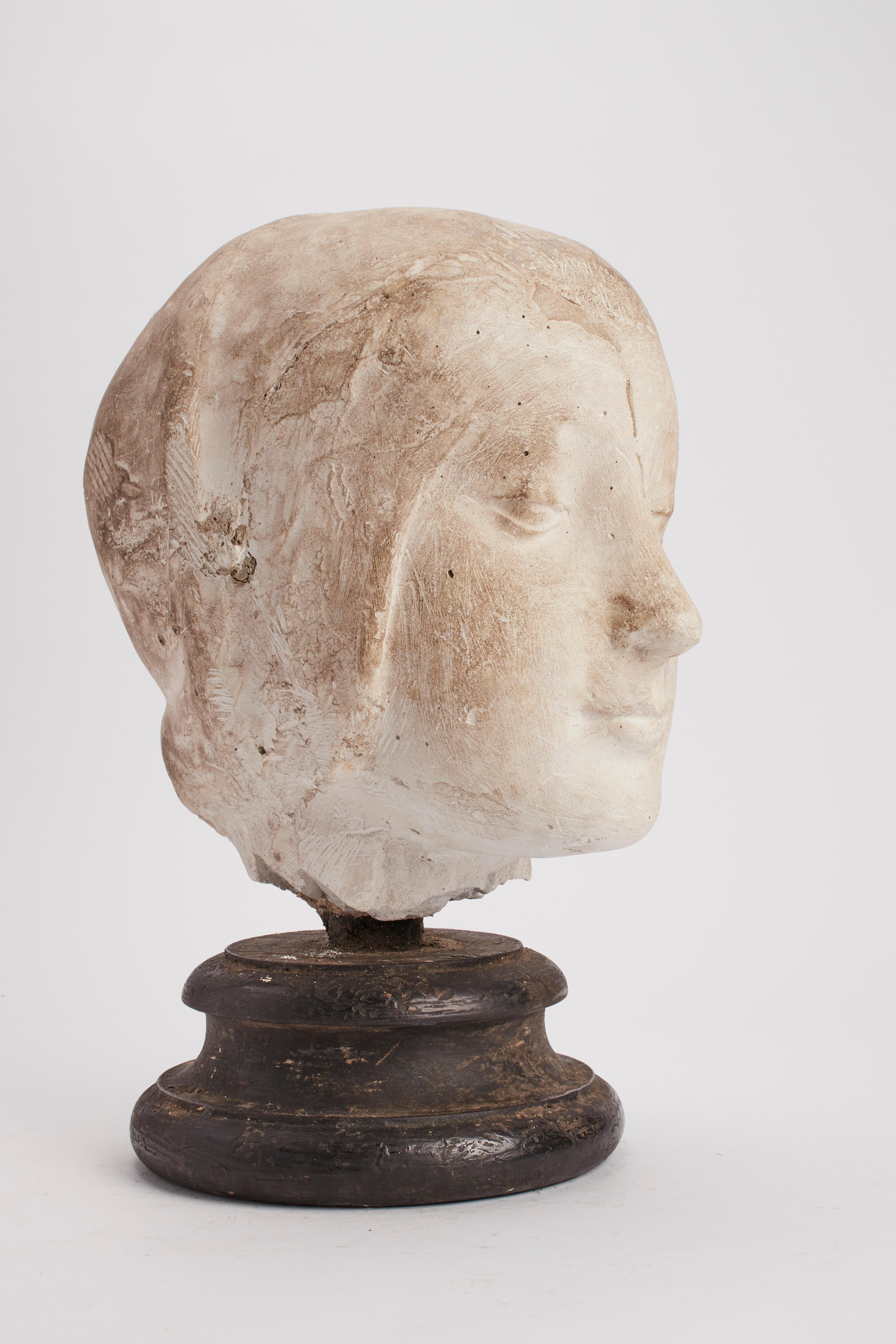 Over the wooden black painted base is set a cast of Eleonora D’Aragona’s head. Copy of the marble sculpture by Laurana. The cast for drawing teaching in Academy. Italy, circa 1890.