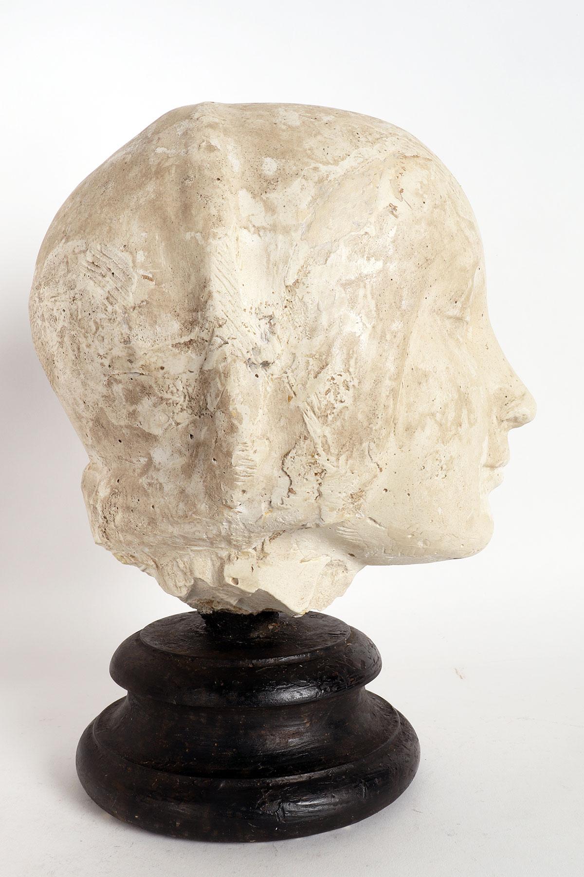Over the wooden black painted base is set a cast of Eleonora D’Aragona head. Copy of the marble sculpture by Laurana. Cast for drawing teaching in Academy. Italy circa 1890.