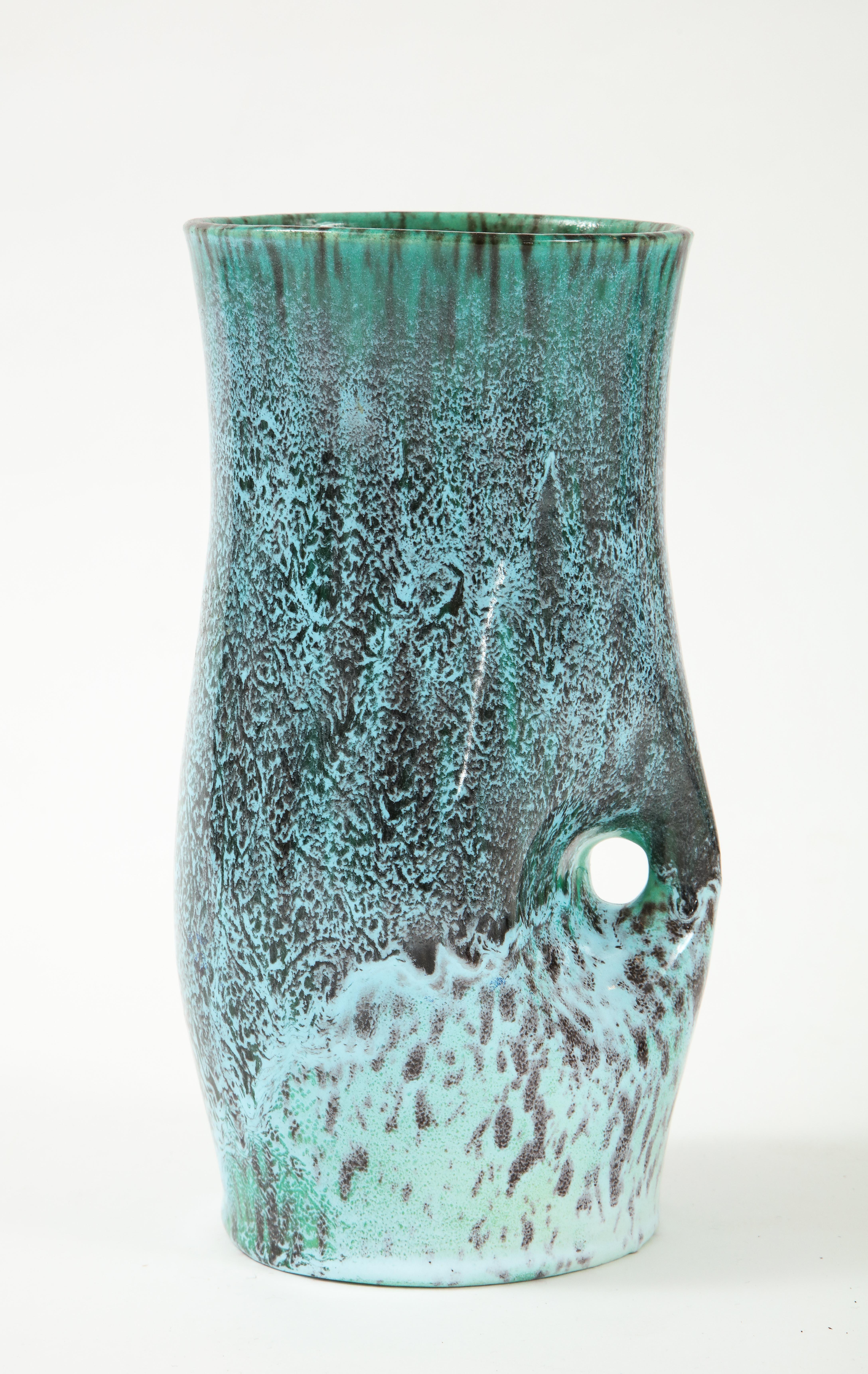 A unique vase produced by Accolay Pottery in France. One of many pieces of Accolay in our inventory, we love this accent piece for its form and beautiful glaze.