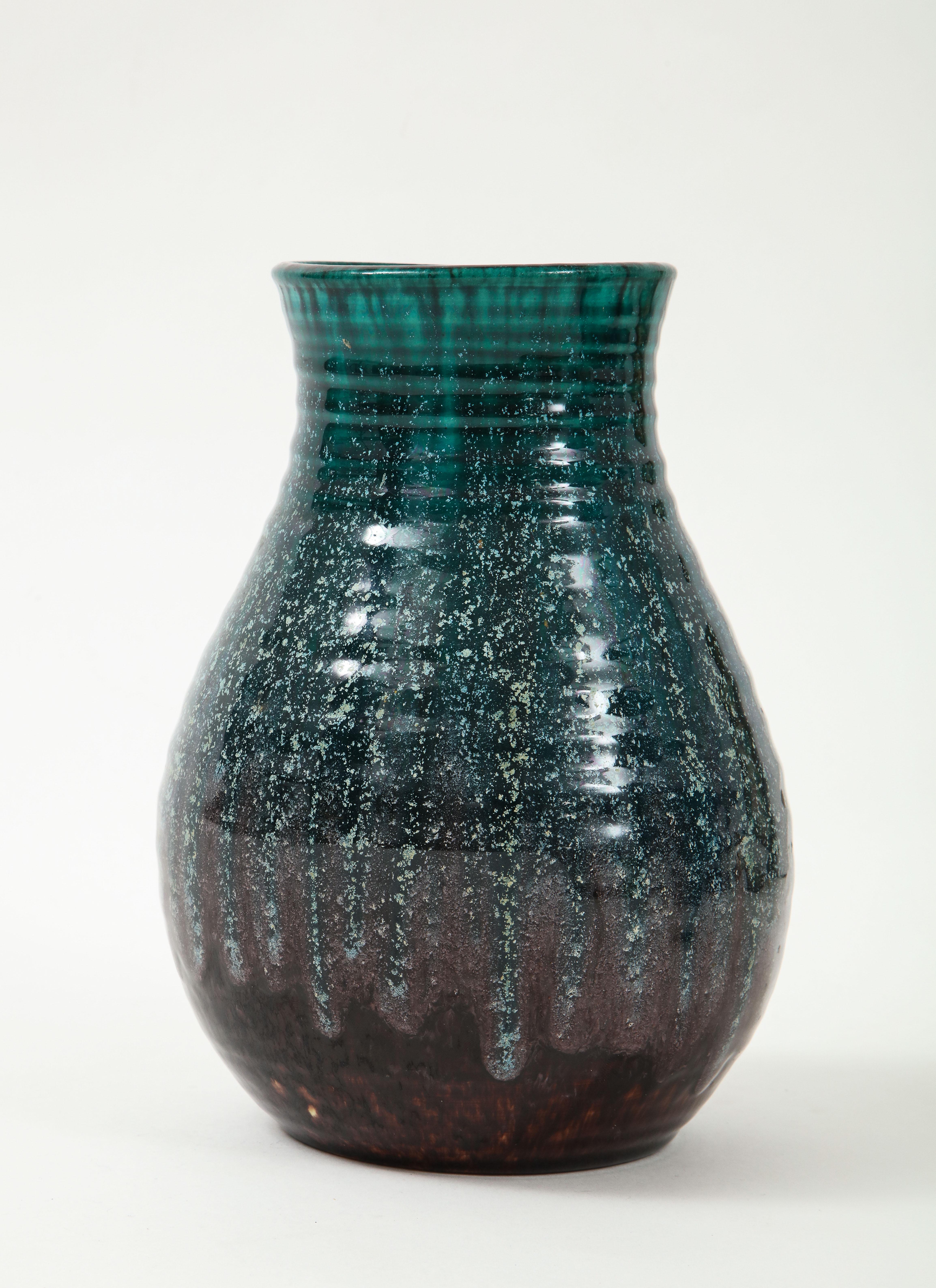 A unique vase produced by Accolay Pottery in France. One of many pieces of Accolay in our inventory, we love this accent piece for its form and beautiful glaze.
