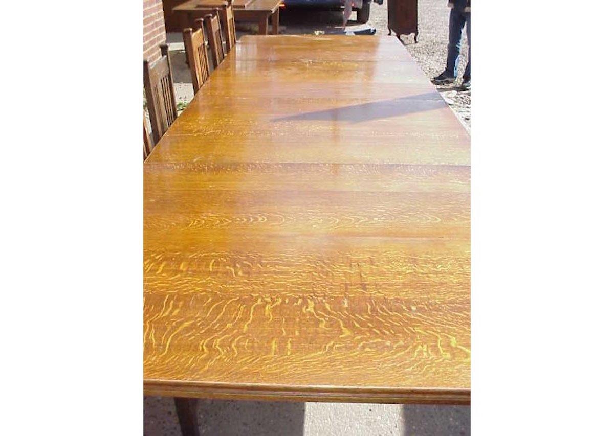 A pair of good quality Aesthetic movement come Arts & Crafts solid oak dining tables with wonderful quarter sawn tiger grain throughout the oak on square legs with chamfered edges. They are designed to be used as two separate dining tables or when