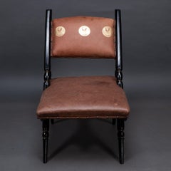An Aesthetic Movement A frame ebonized chair in the style of Dr C Dresser